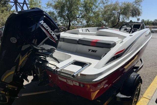 2026 Tahoe T16 boat with Mercury engine, parked outdoors on a trailer.