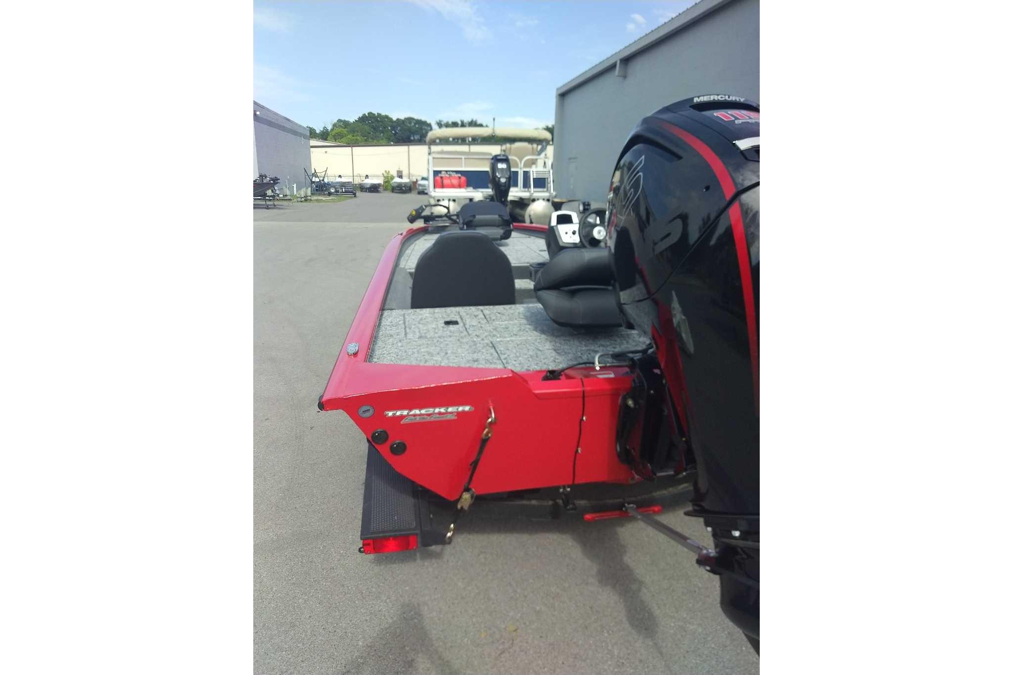 2026 Tracker Pro Team 190 boat with Mercury engine, parked outdoors.