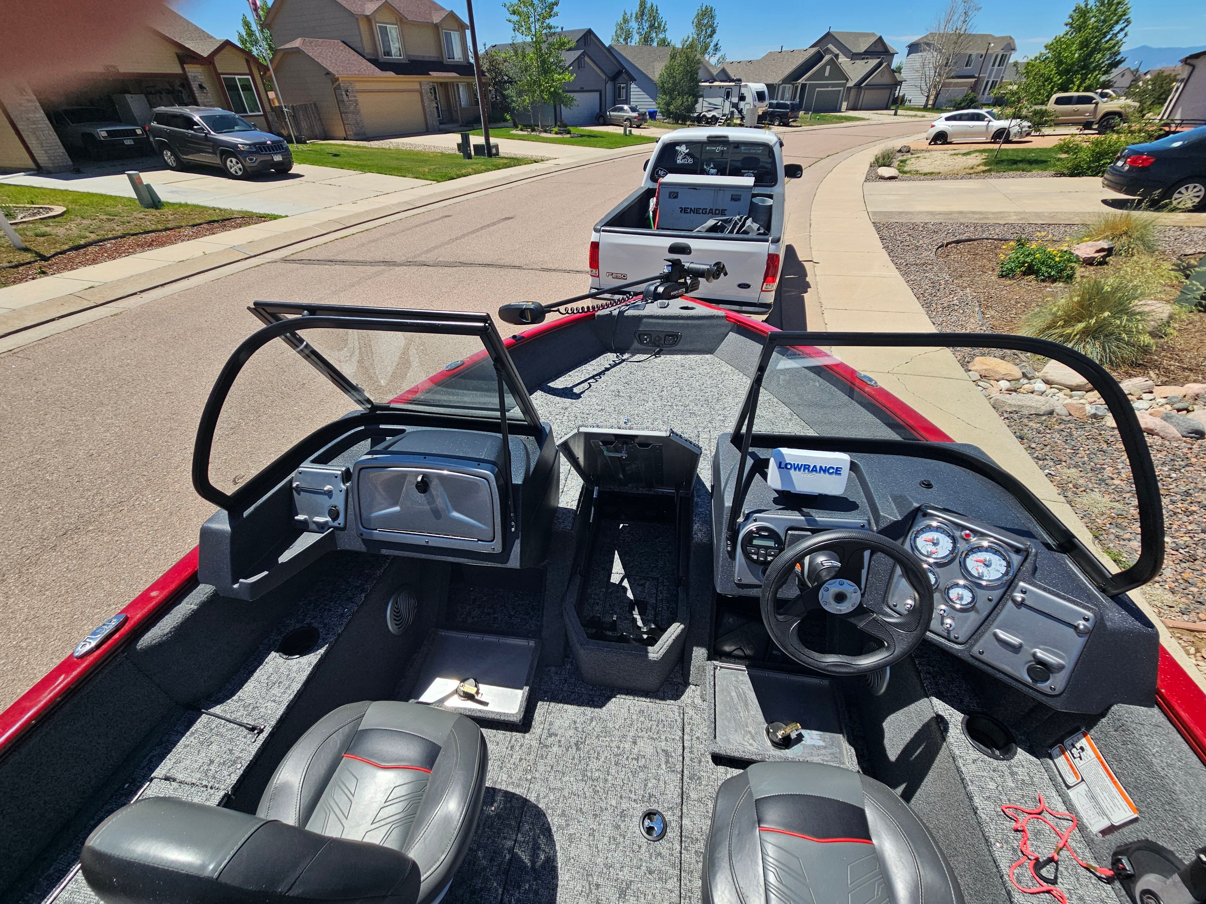 2021 Tracker Pro Guide V-175 WT on trailer in residential area.