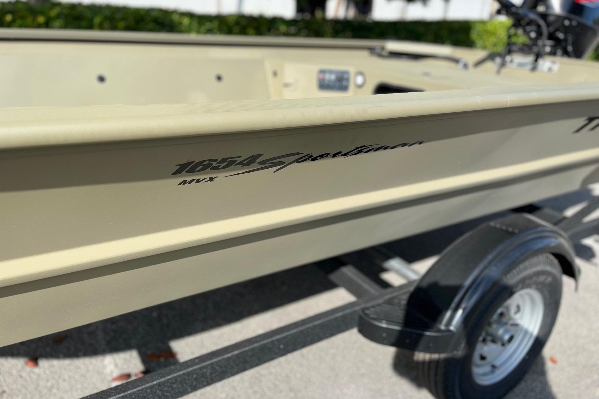 2026 Tracker Grizzly 1654 T Sportsman boat on trailer, close-up view.