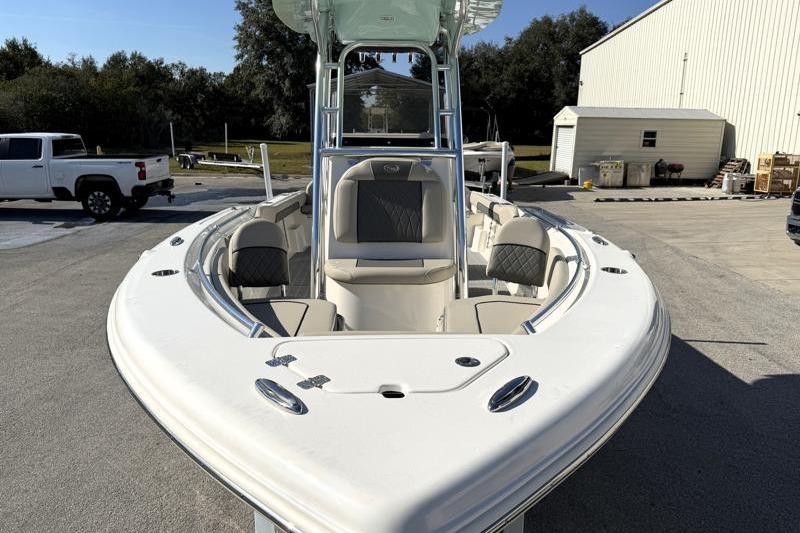 2025 Key West 239 FS boat with sleek design, parked outdoors on a sunny day.