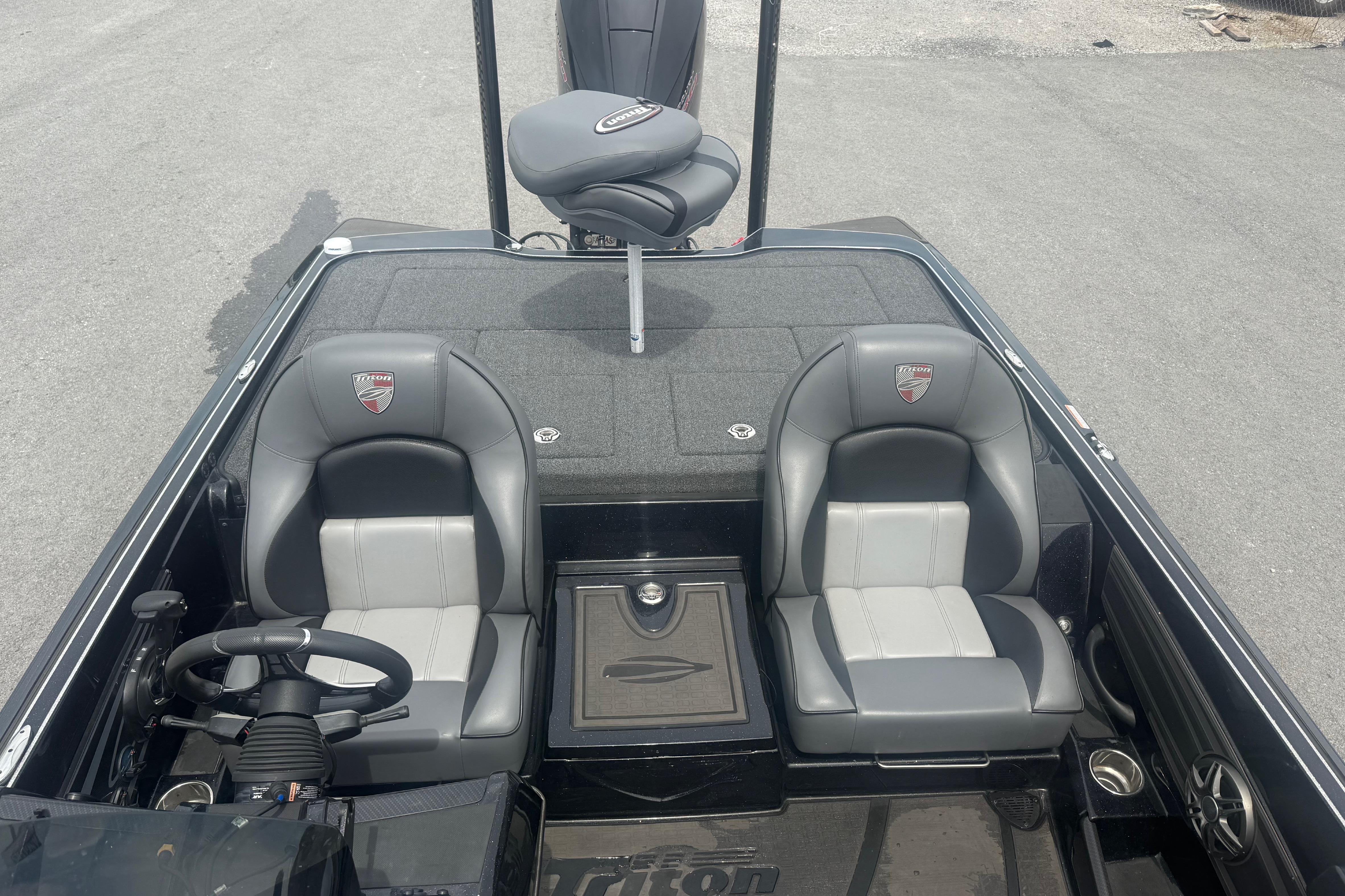2024 Triton 20XP boat interior with dual seats and steering wheel.