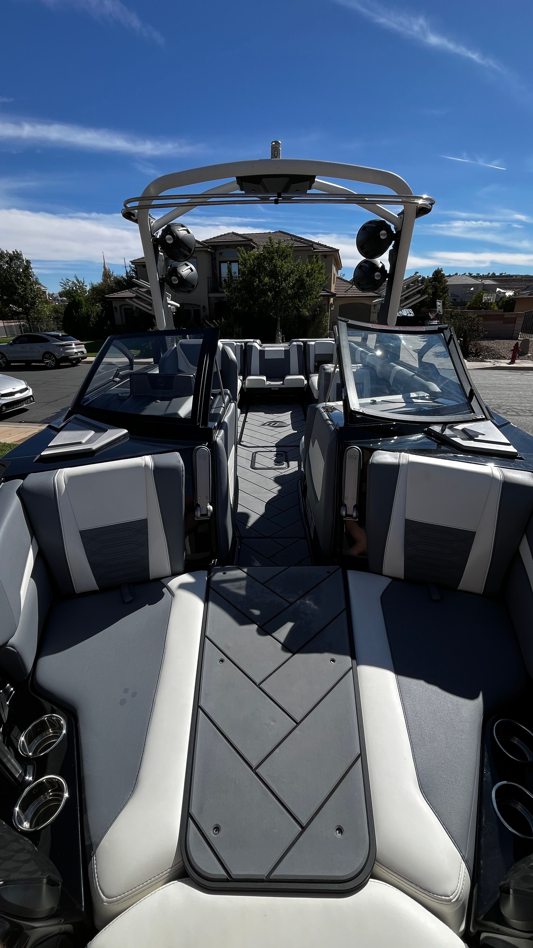 The image shows the interior of a 2023 Malibu Wakesetter 26 LSV with modern seating and speakers.