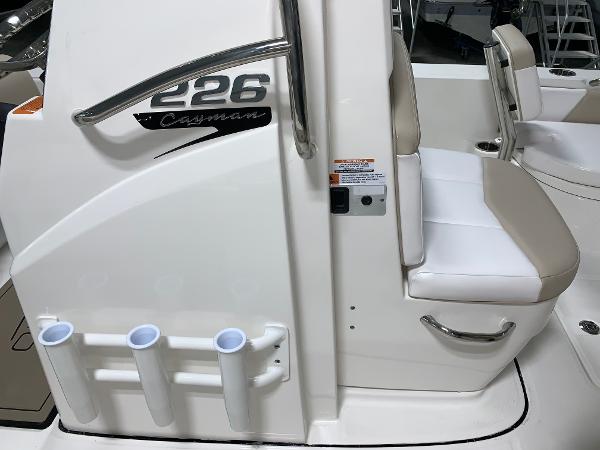 2026 Robalo 226 Cayman boat interior with seating and rod holders.