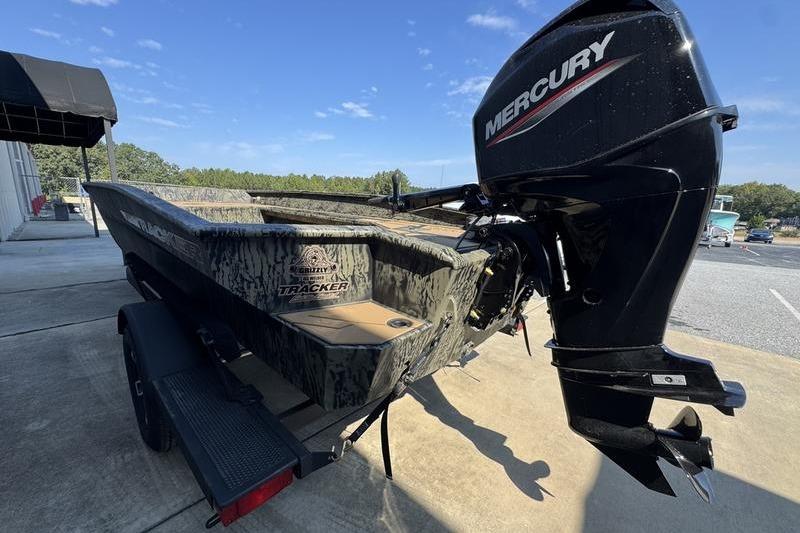 2026 Tracker Grizzly 1756 T Marsh boat with Mercury outboard motor on trailer.