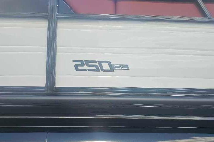 2026 Regency 250 DL boat exterior with model emblem displayed.