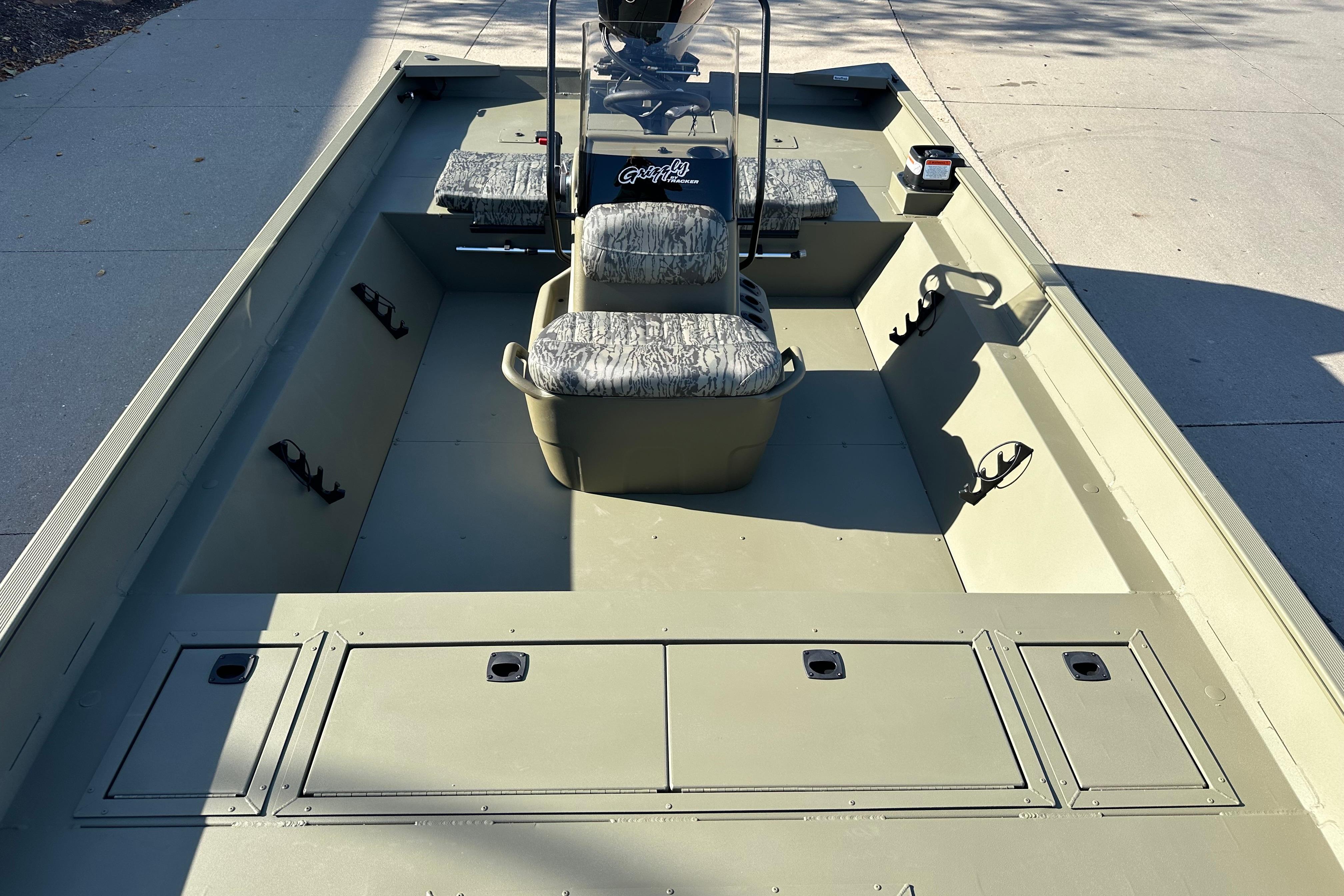2026 Tracker Grizzly 2072 CC boat interior with seating and storage compartments.
