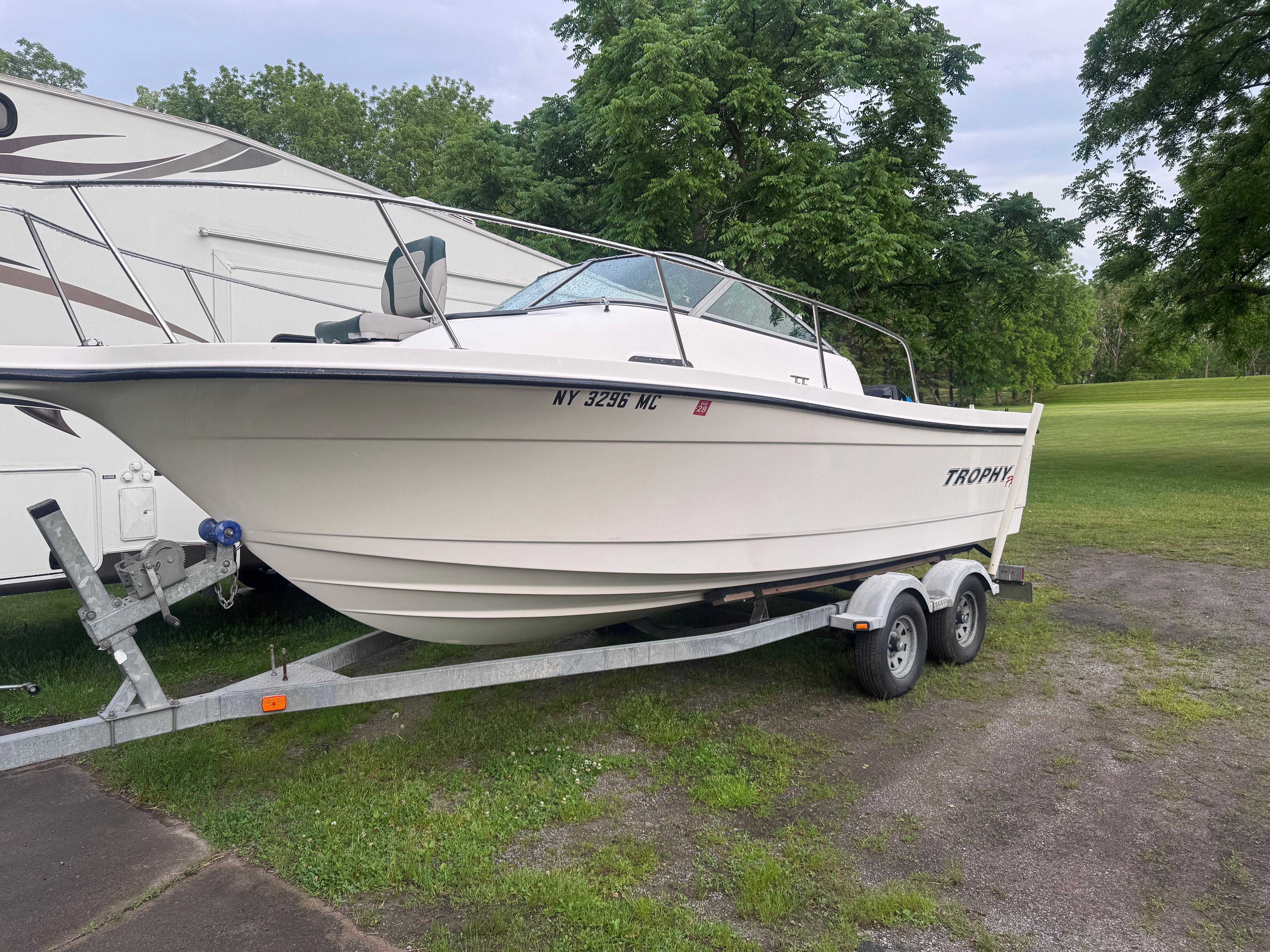 2005 Bayliner Trophy boat on trailer parked outdoors.