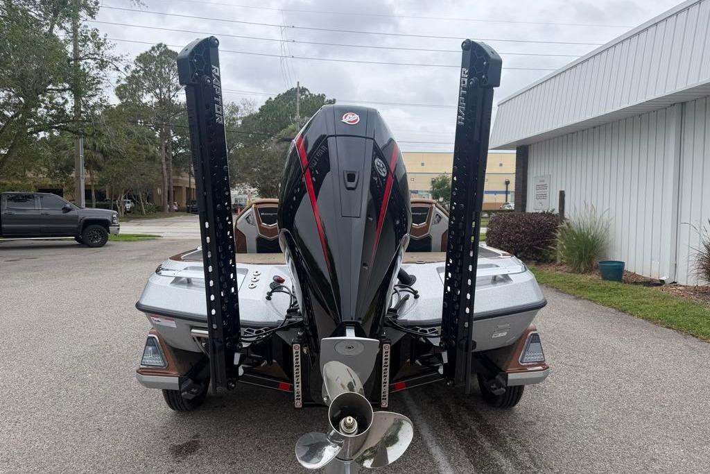 2026 Ranger Z520R boat with powerful outboard motor, parked outdoors.