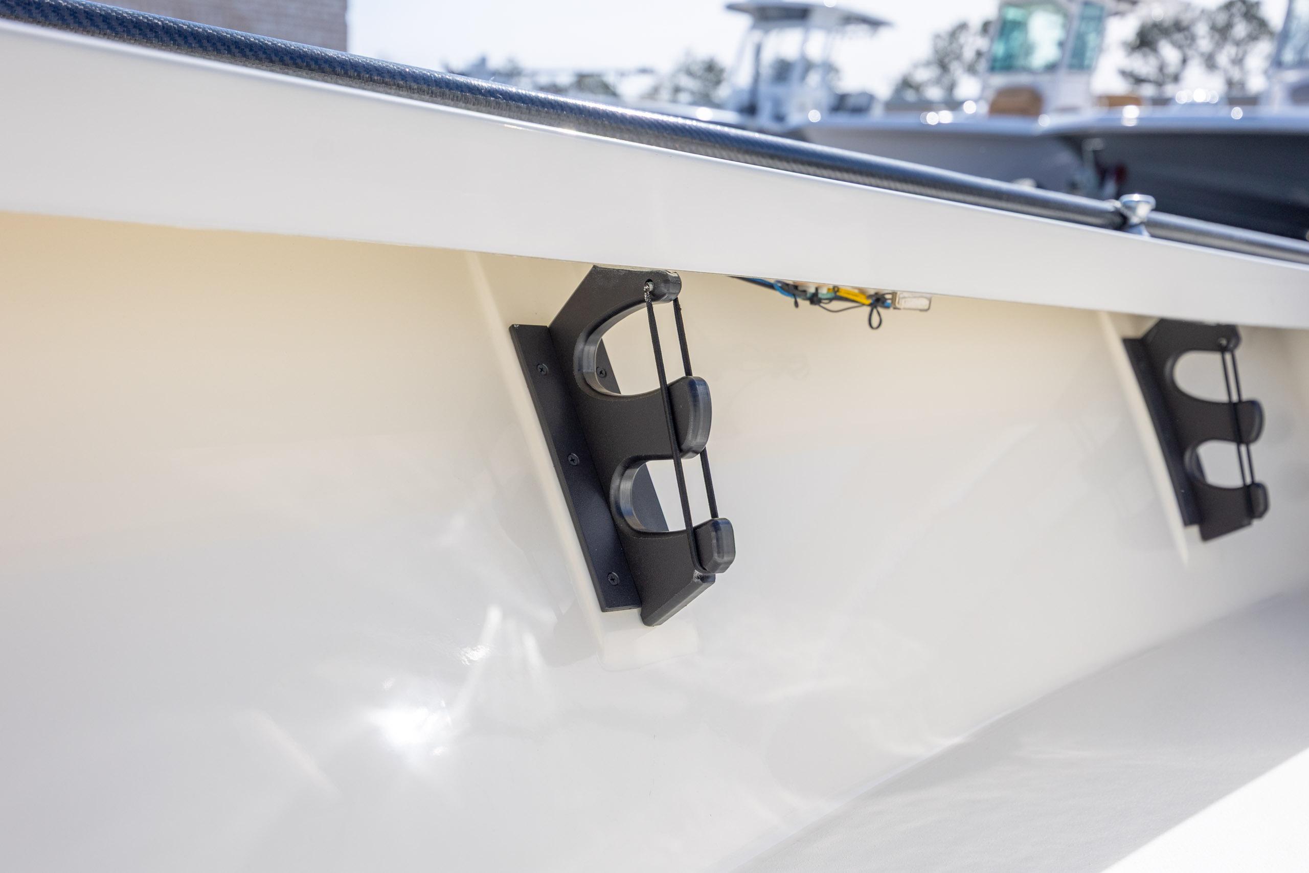 2024 Maverick 17 HPX-S boat interior with rod holders, showcasing sleek design.