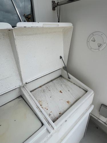 Open storage compartment on 1985 Hatteras 45 Convertible boat.