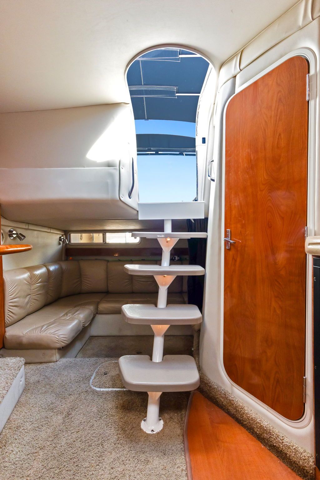 Interior of Larson Cabrio 330 with stairs and seating area.