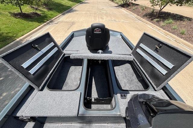 2026 Ranger RT188 boat interior with open storage compartments on a sunny day.
