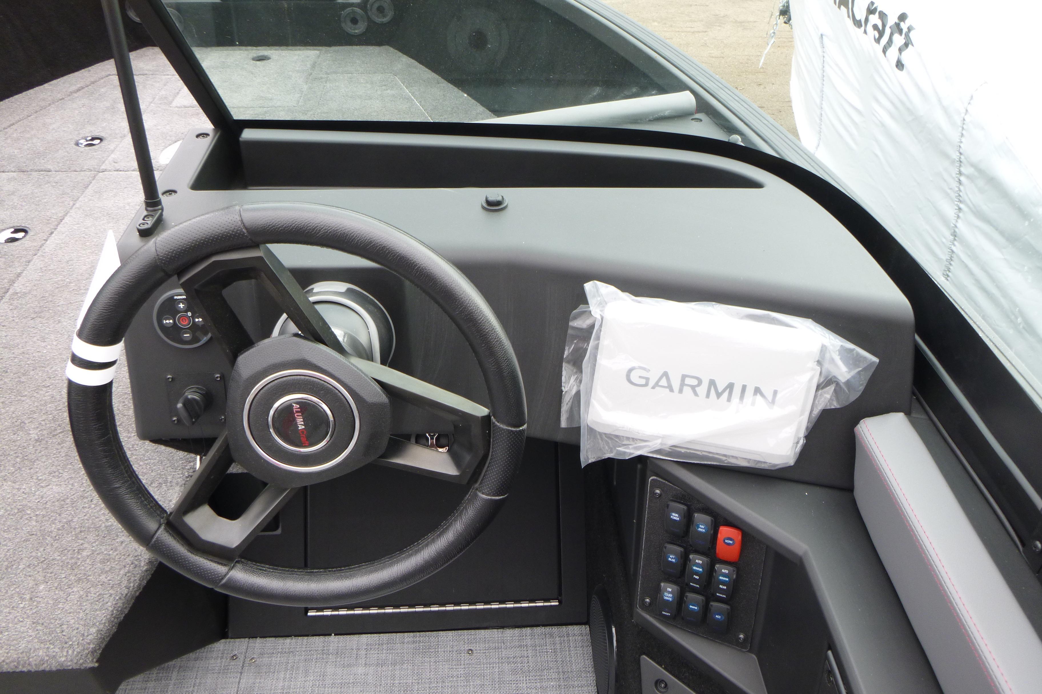 2025 Alumacraft Trophy 185X Sport dashboard with Garmin navigation system and steering wheel.