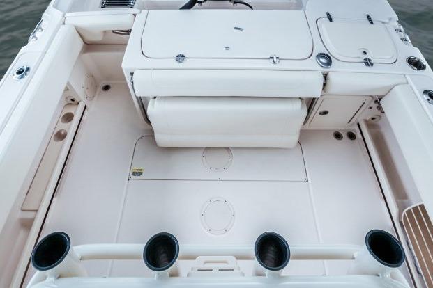 2025 Grady-White Fisherman 257 boat interior with rod holders and storage compartments.