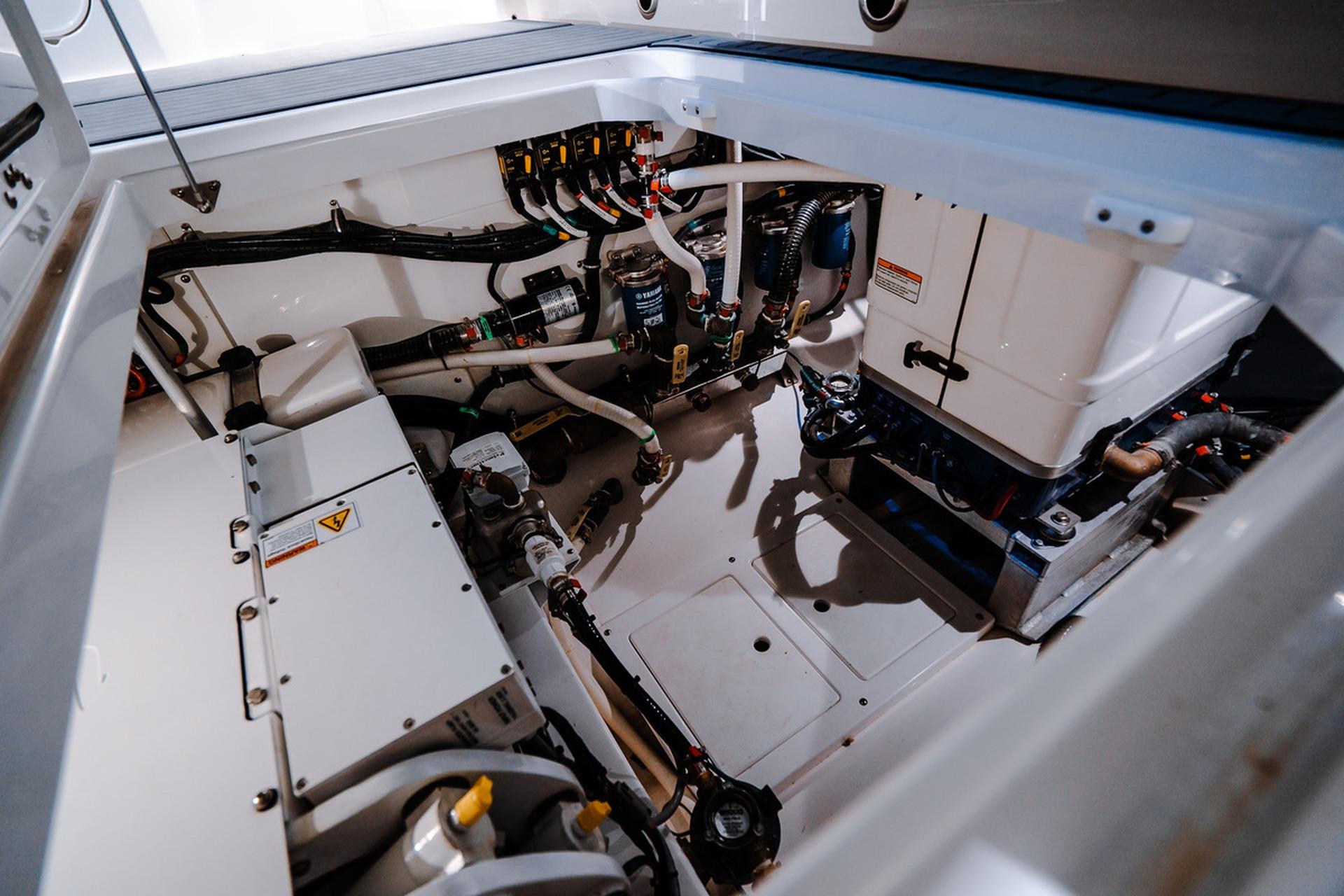 Engine compartment of 2026 Everglades 455 Center Console boat, showcasing advanced mechanical systems.