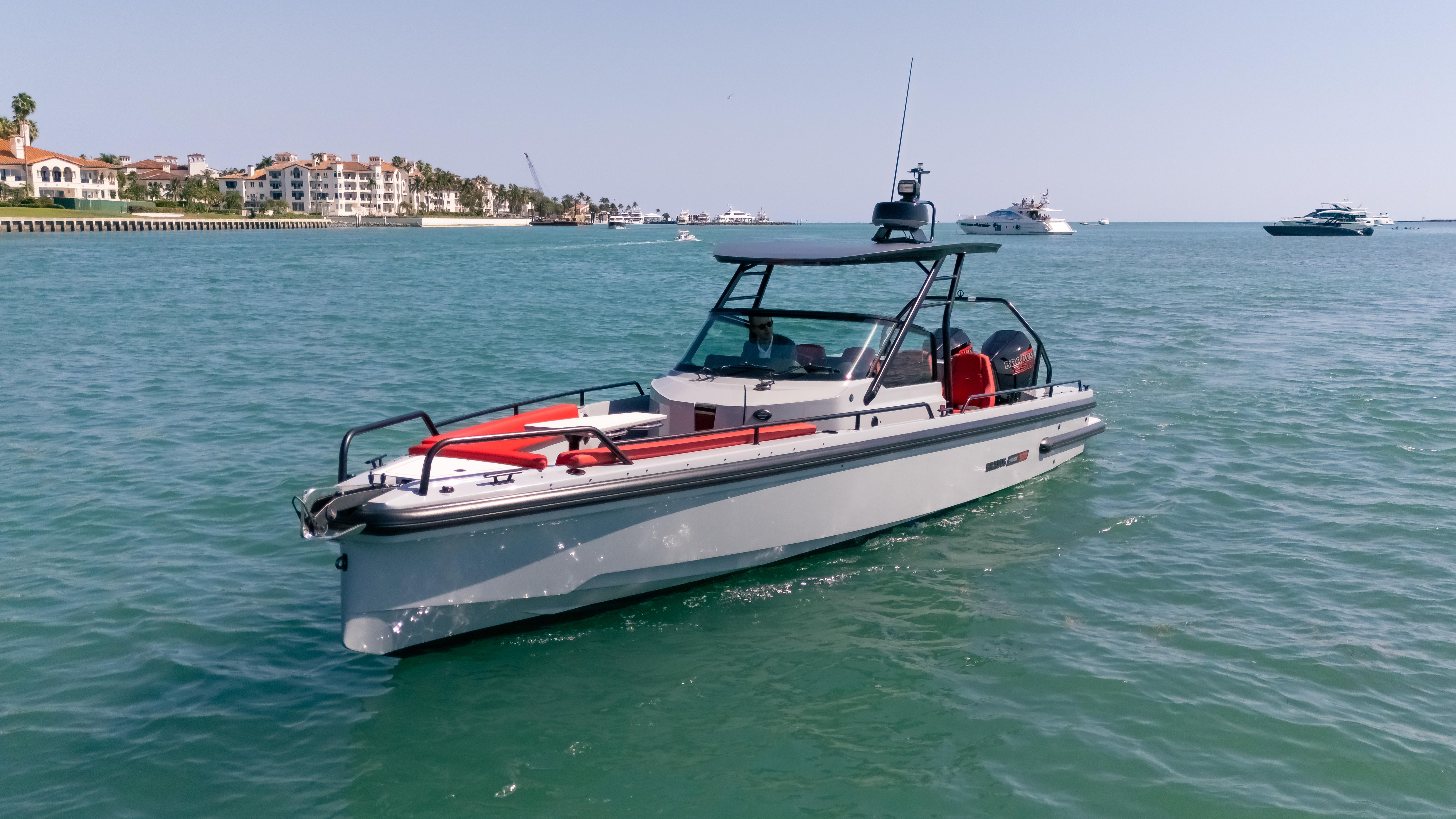 2023 BRABUS Shadow 500 T-Top boat cruising on clear blue water.