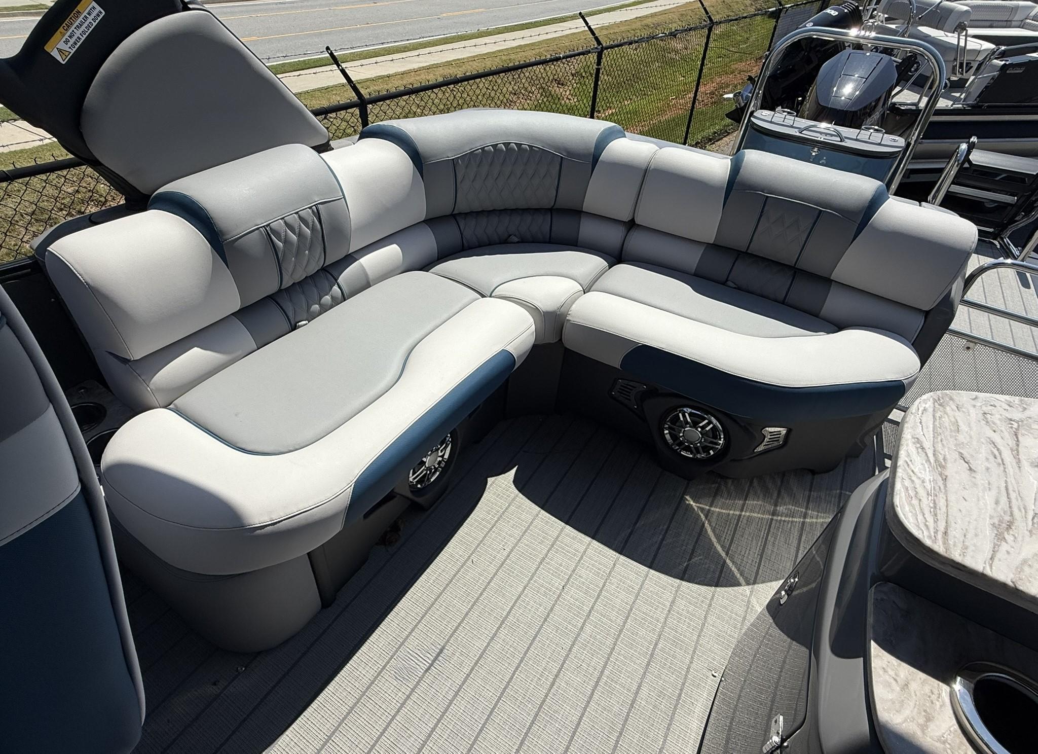 Luxurious seating on 2025 Tahoe Pontoon Grand Tahoe Elite Windshield boat, featuring plush upholstery.