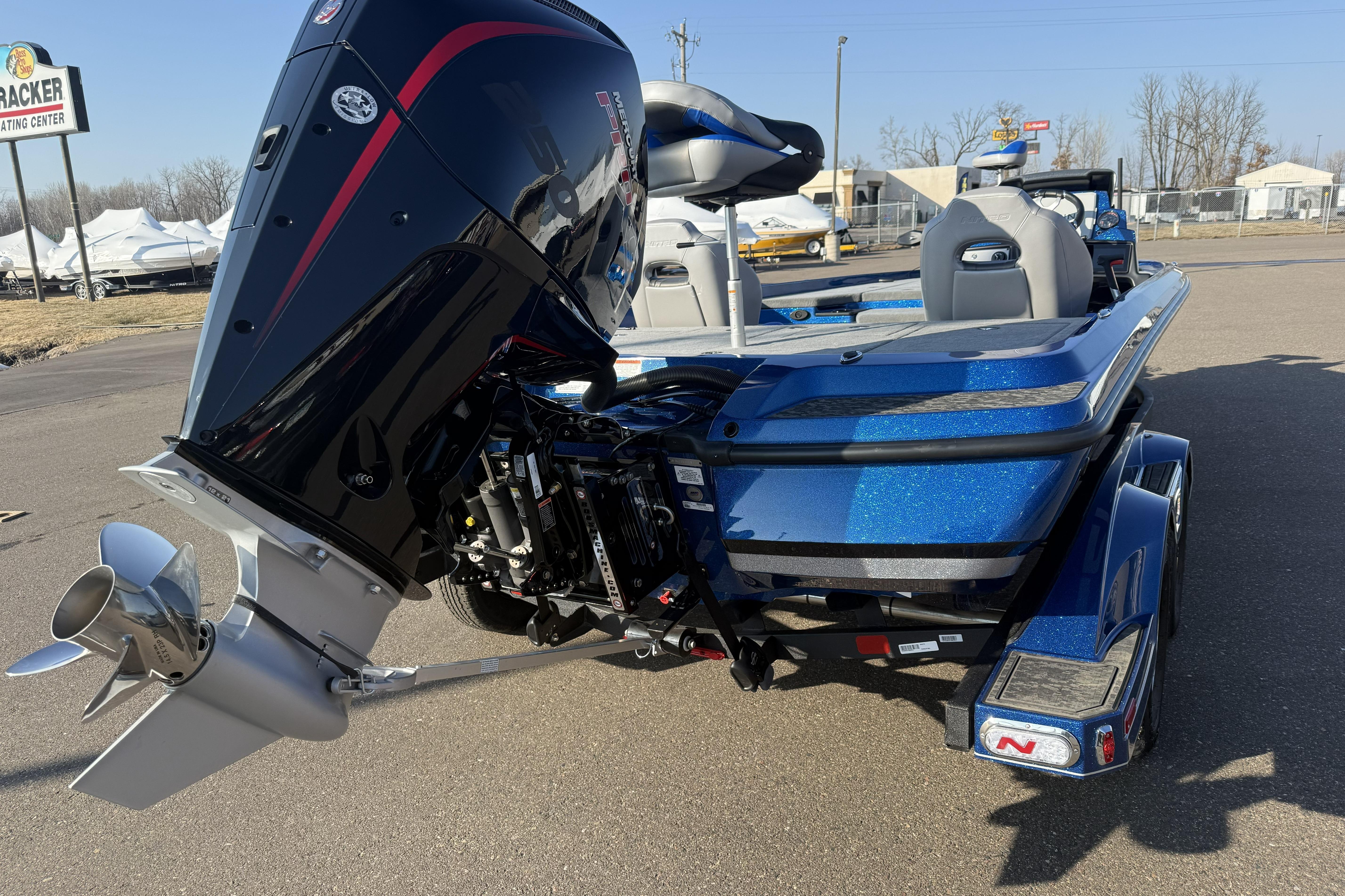 2026 Nitro Z21 XL Pro boat with powerful outboard motor, parked on a trailer.