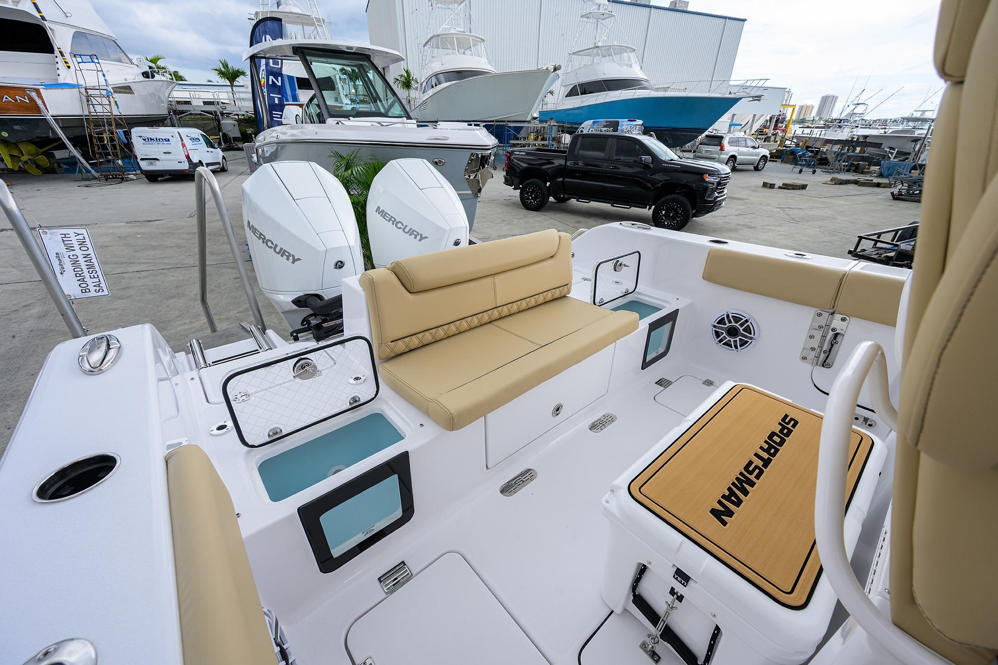 2026 Sportsman Heritage 261 Center Console boat interior with seating and Mercury engines.