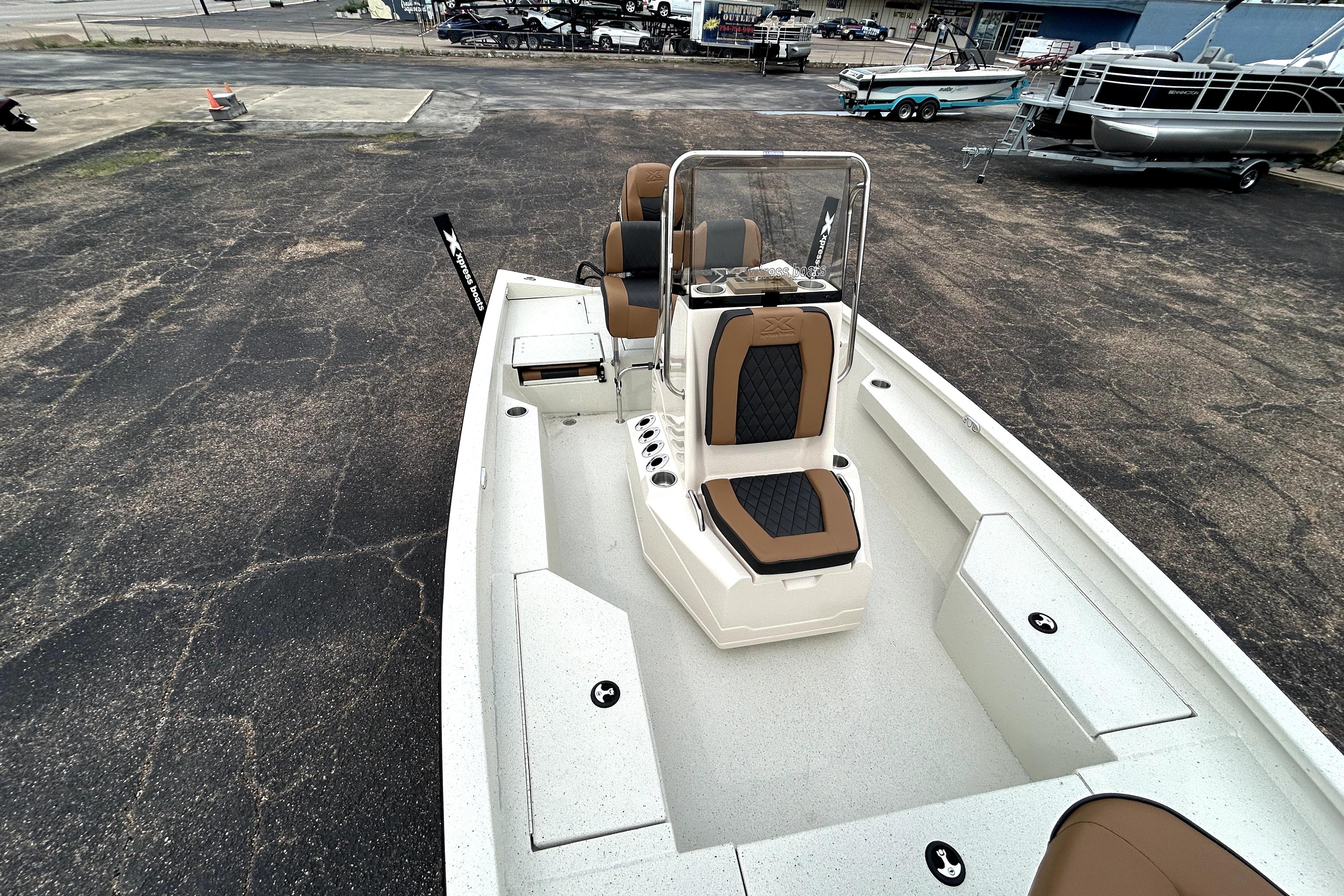 2026 Xpress H20B Bay boat with sleek seating and spacious deck design.
