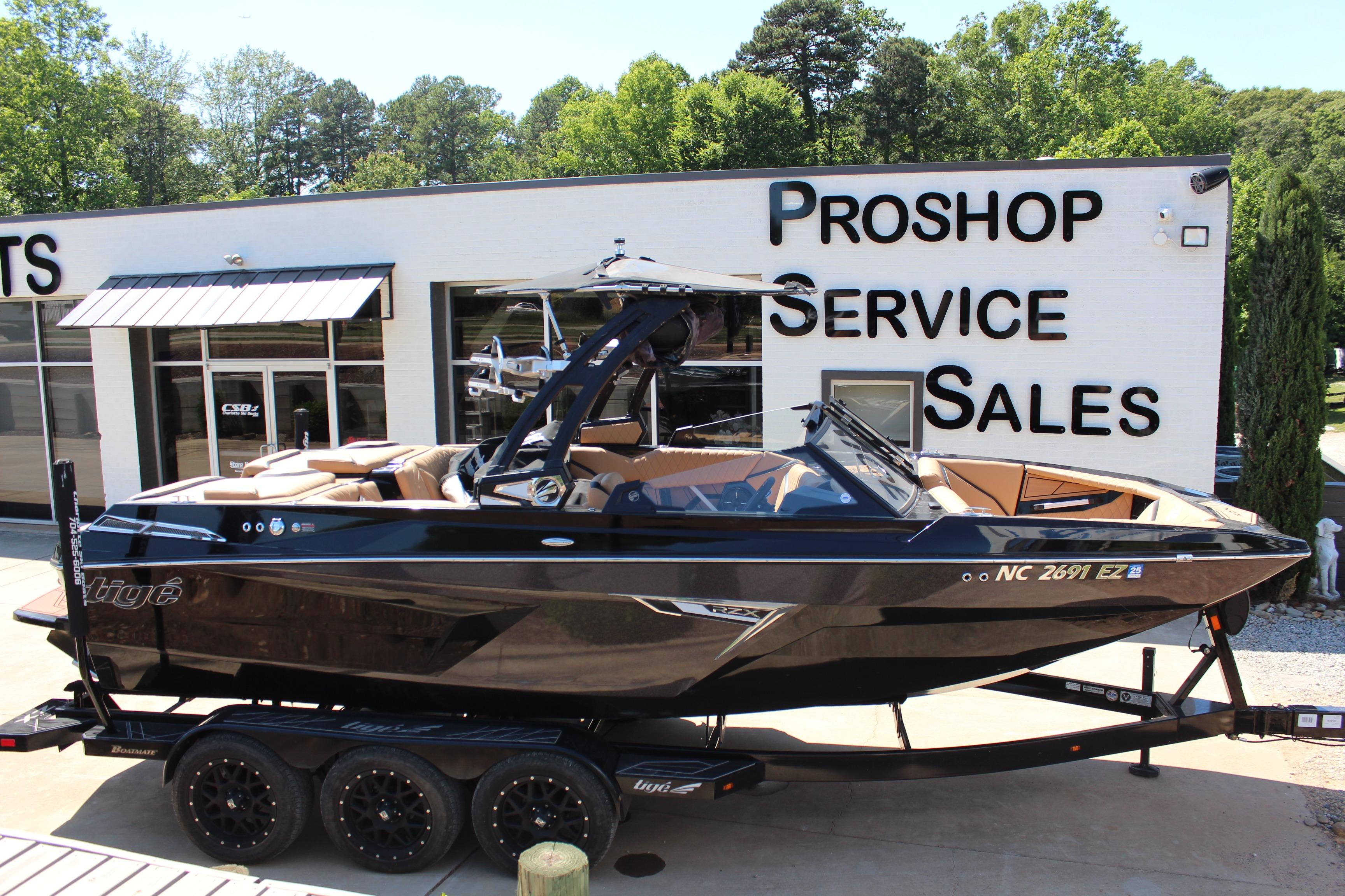 2022 Tigé 22RZX boat on trailer outside service and sales shop.