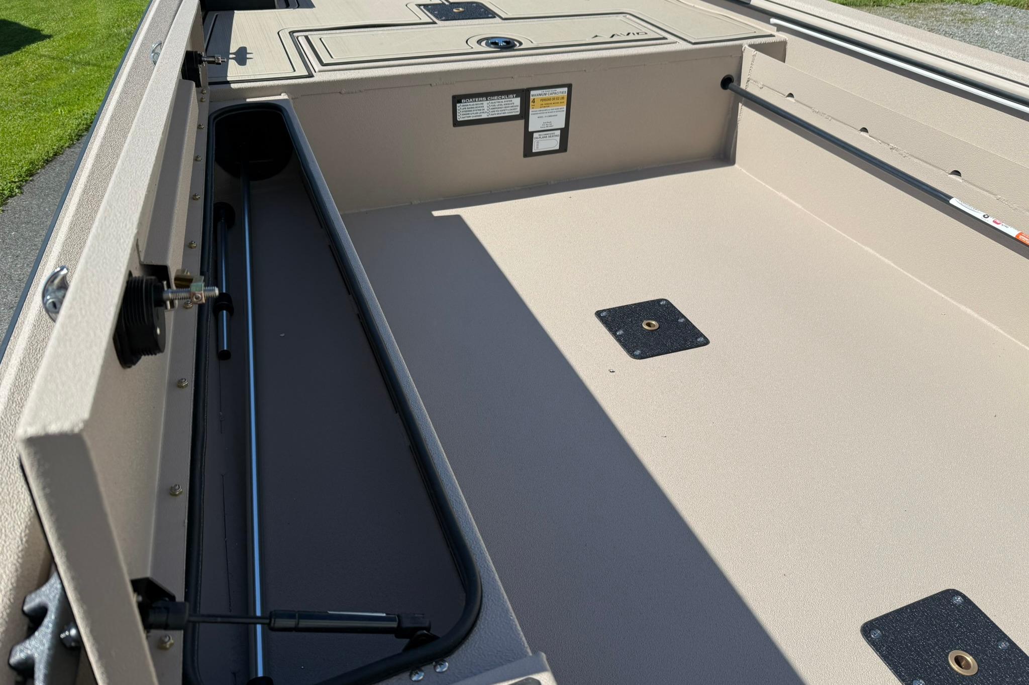 2026 Avid 16 Commander boat interior with storage compartments and clean deck design.