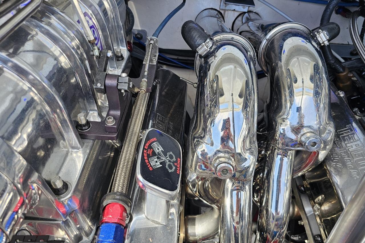 Close-up of a 2002 Formula 382 FASTech engine with polished chrome components.