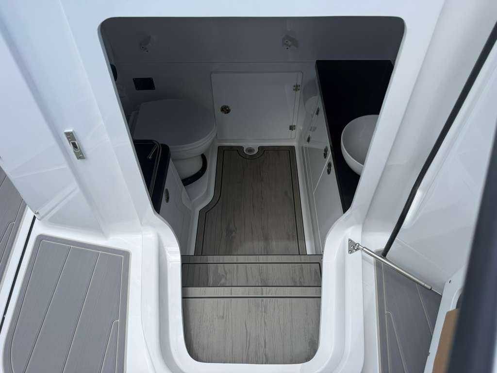 Interior of the Monterey Elite 30 OB with toilet and sink.