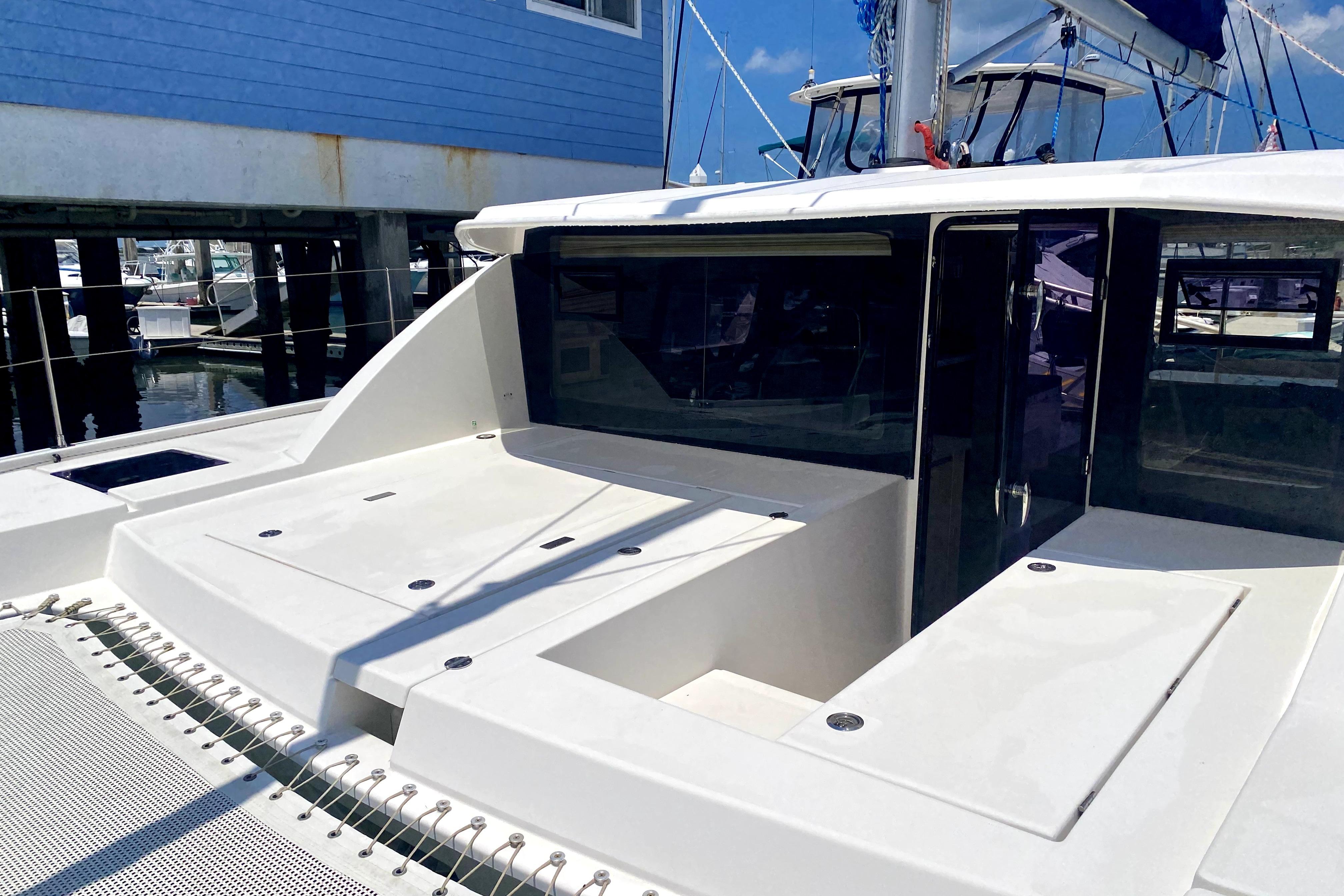 2017 Leopard 40 catamaran docked, showcasing sleek design and spacious deck area.