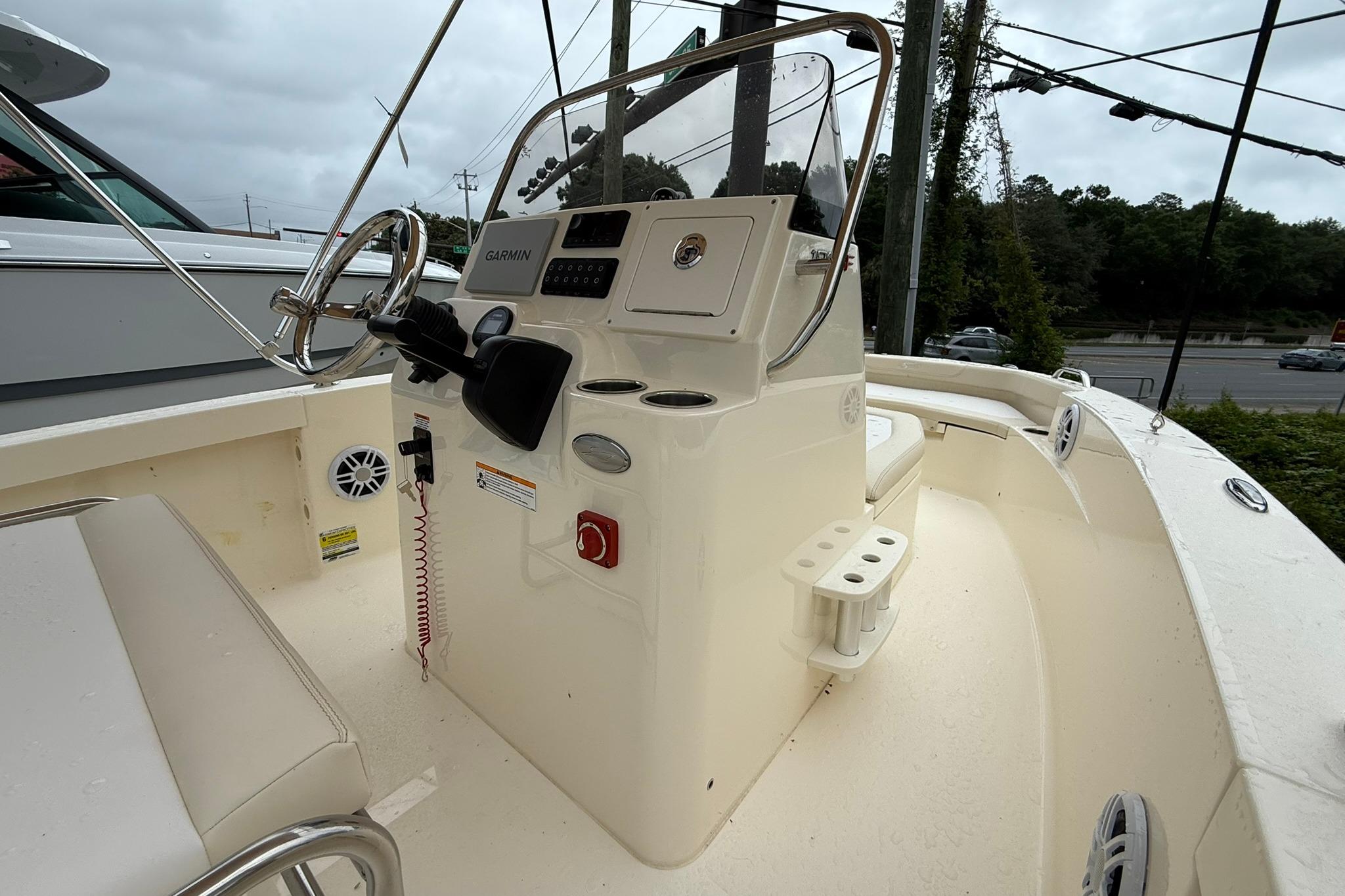 2027 Scout 188 Sportfish boat interior with steering console and Garmin navigation system.