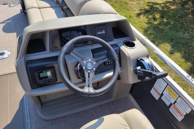 2025 Sun Tracker Party Barge 22 RF XP3 steering console with controls and seating.