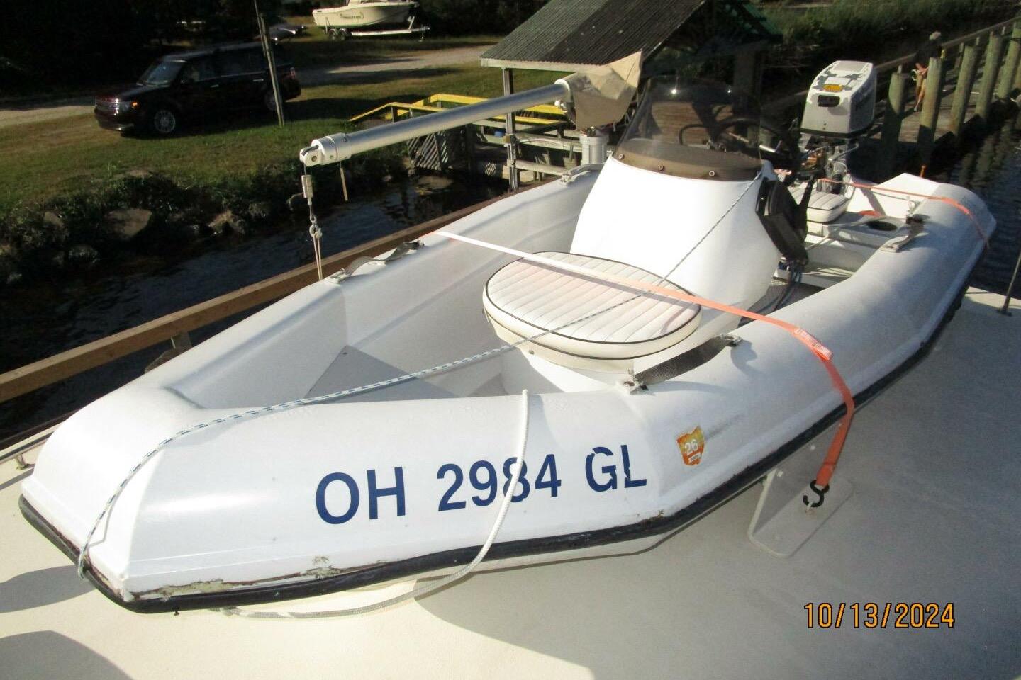 1997 Rosborough Trawler with inflatable dinghy, docked, featuring registration number OH 2984 GL.