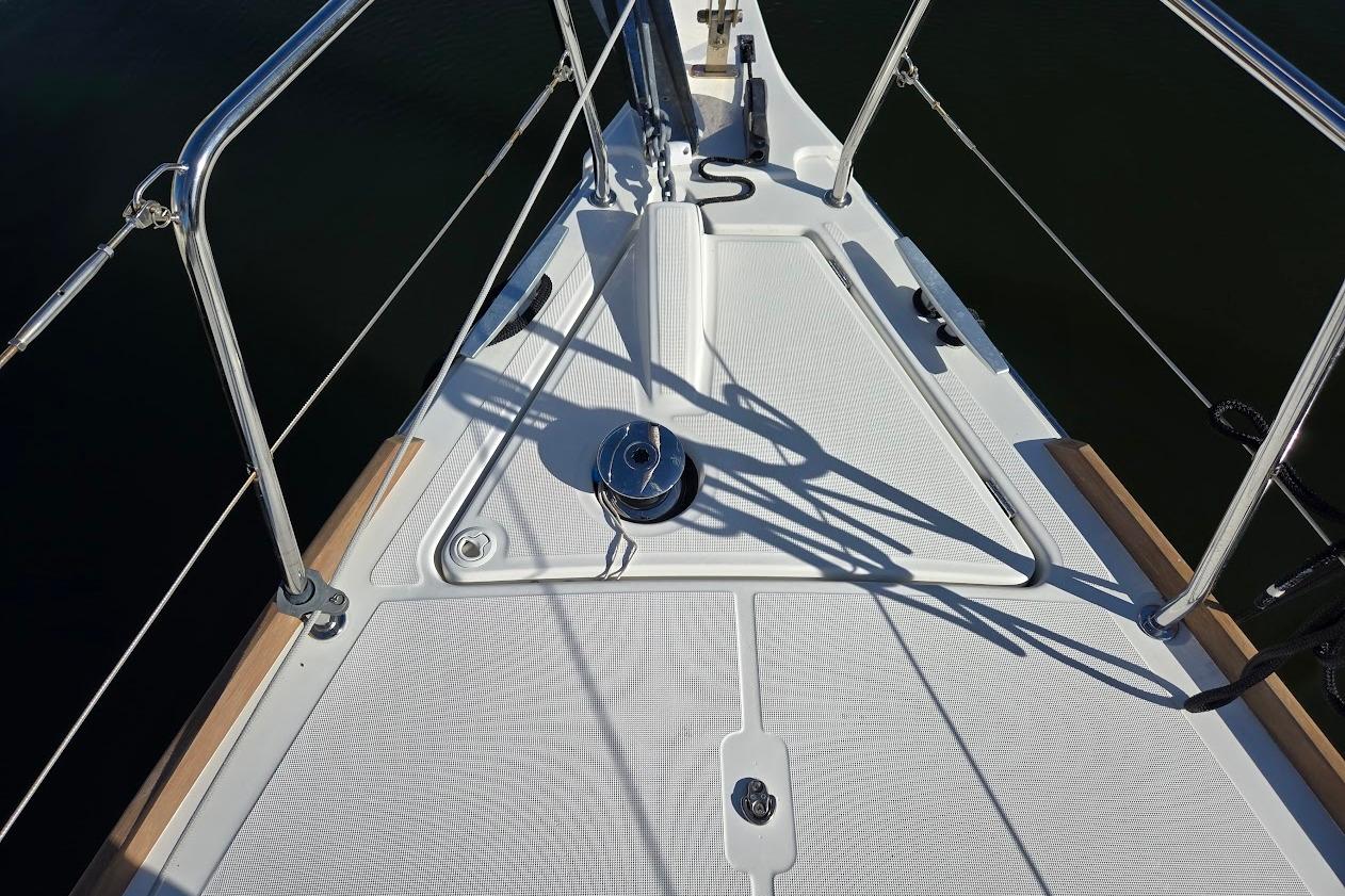 Deck view of 2023 Beneteau Oceanis 38.1 sailboat, featuring sleek design and stainless steel railings.