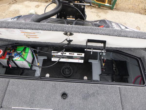 2025 Ranger Z521 boat battery compartment with wiring and storage.