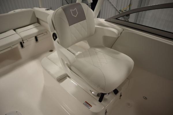 2025 Sea Fox 228 Traveler boat interior with white cushioned seating.