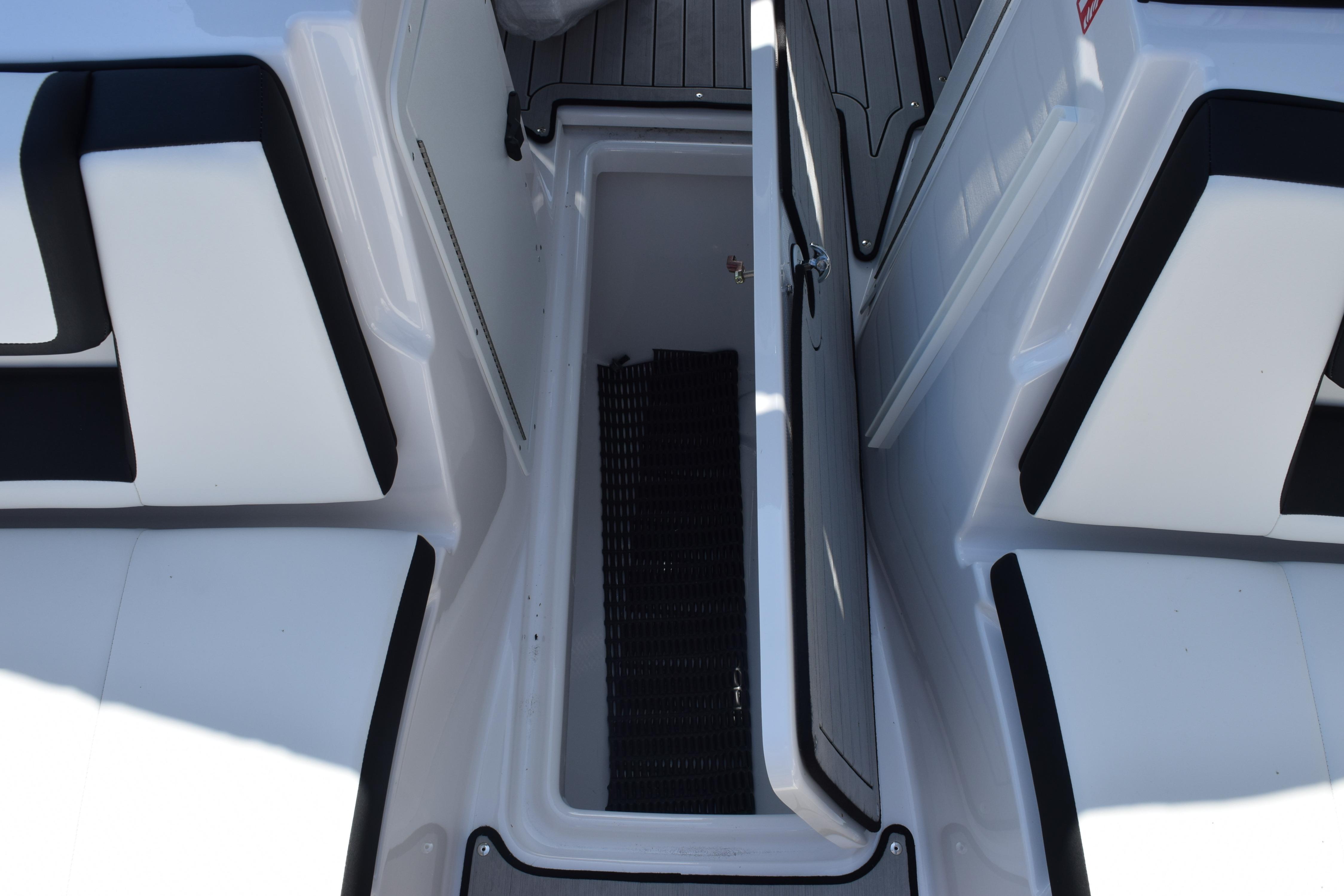 2026 Yamaha Boats 222SE interior storage compartment with open hatch and seating.