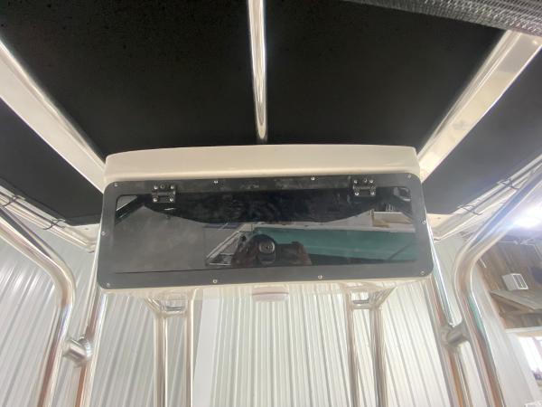 2024 Key West 203 FS boat console with black T-top.