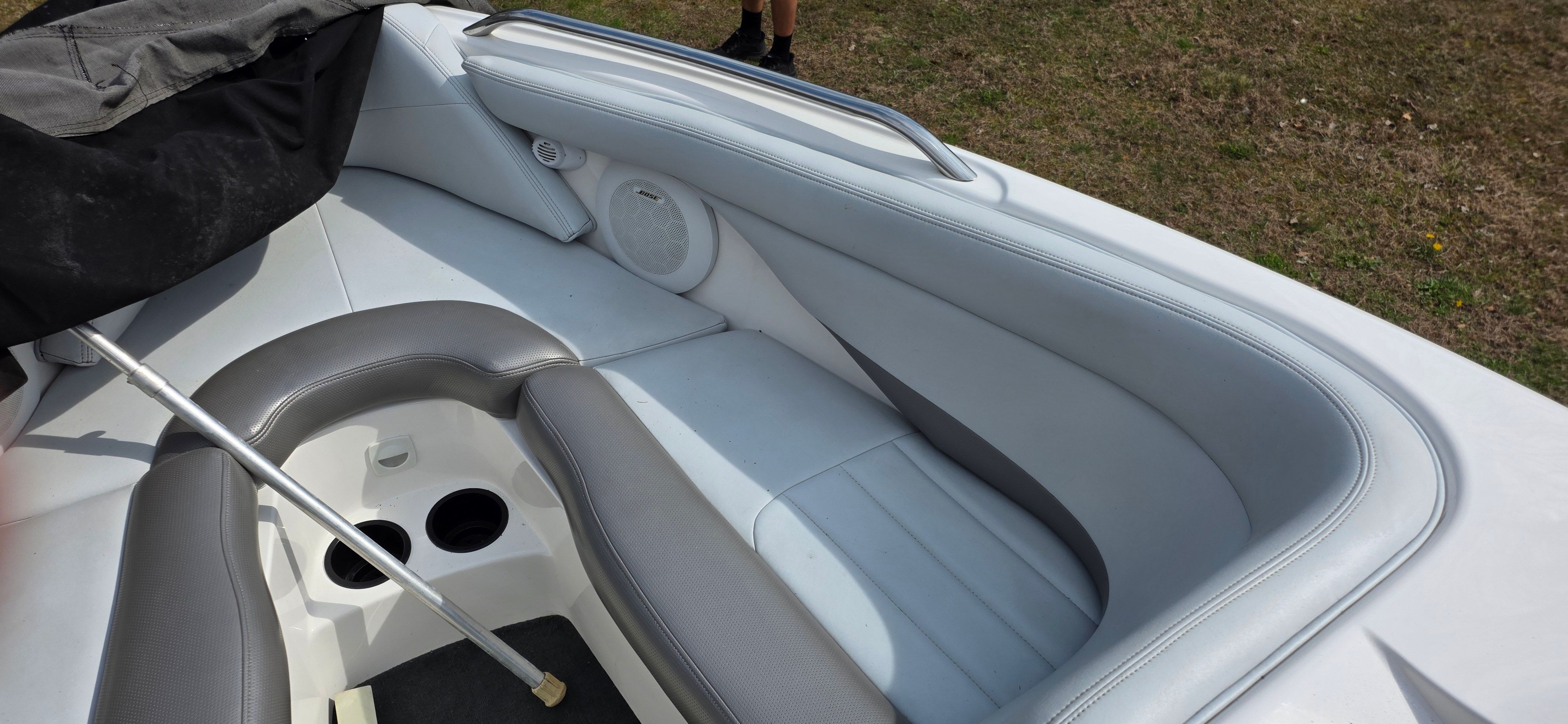 Interior of a 2004 MasterCraft Maristar boat with gray upholstery.
