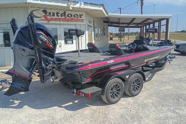 2026 Phoenix 721 ZXL boat on trailer outside dealership.