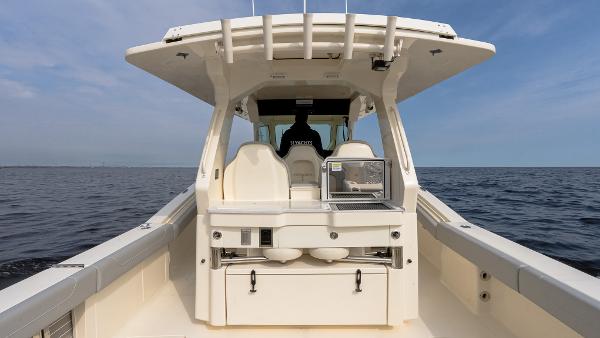 2025 Scout 425 LXF boat on open water, featuring sleek design and modern amenities.