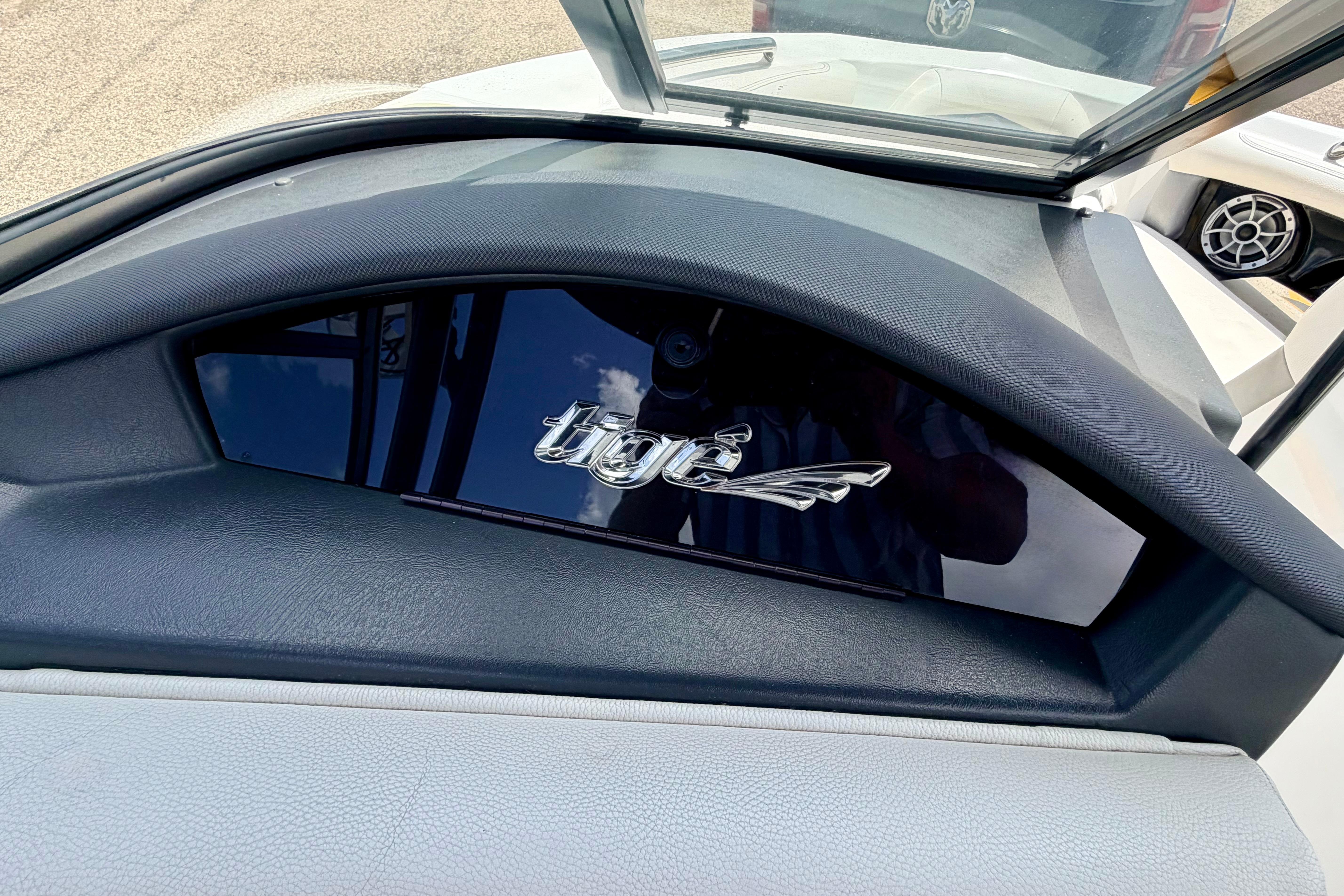Dashboard of a 2014 Tigé R20 boat with logo detail.