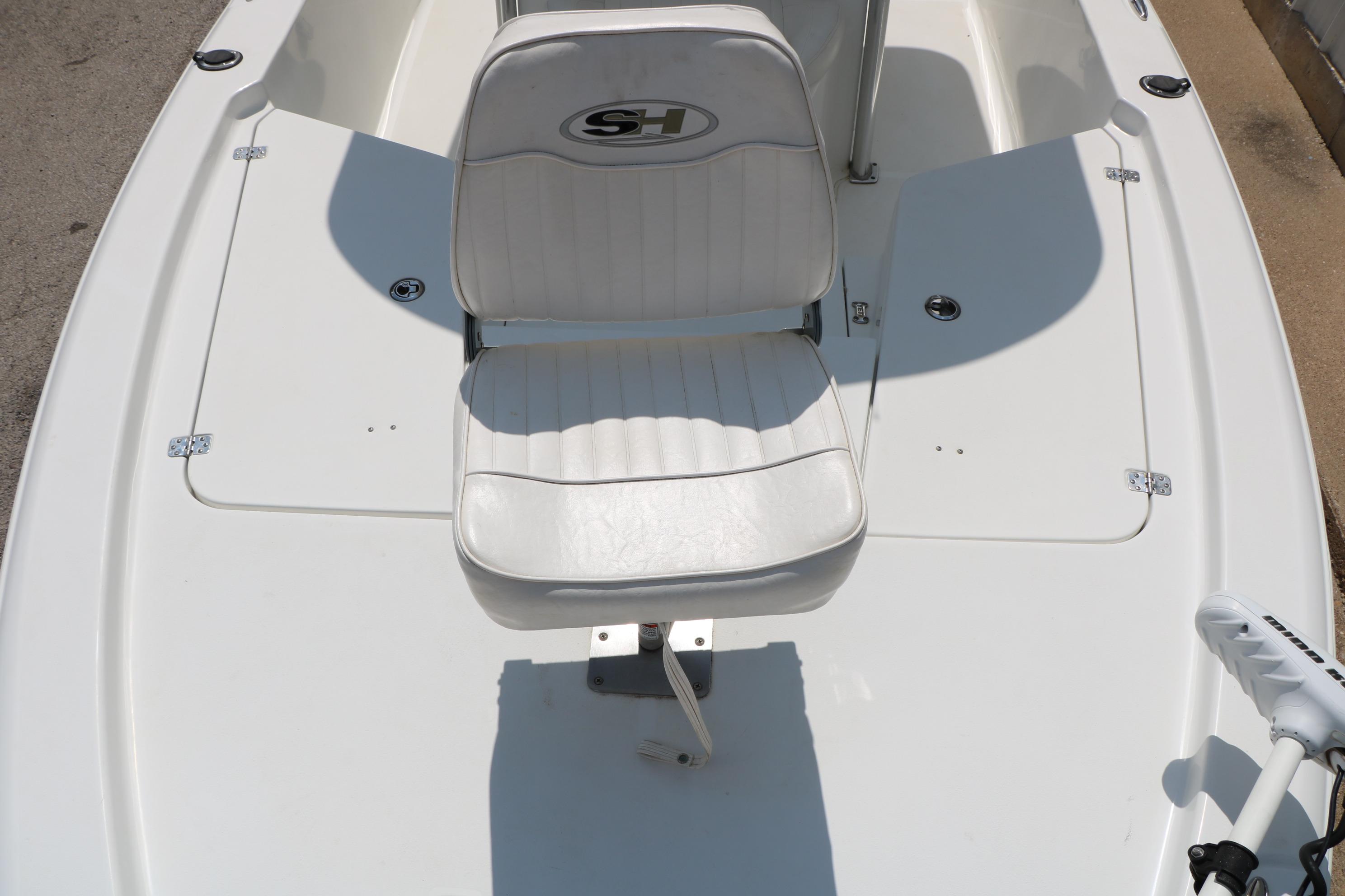 2015 Sea Hunt BX 22 BR boat with white seating and deck, featuring storage compartments.
