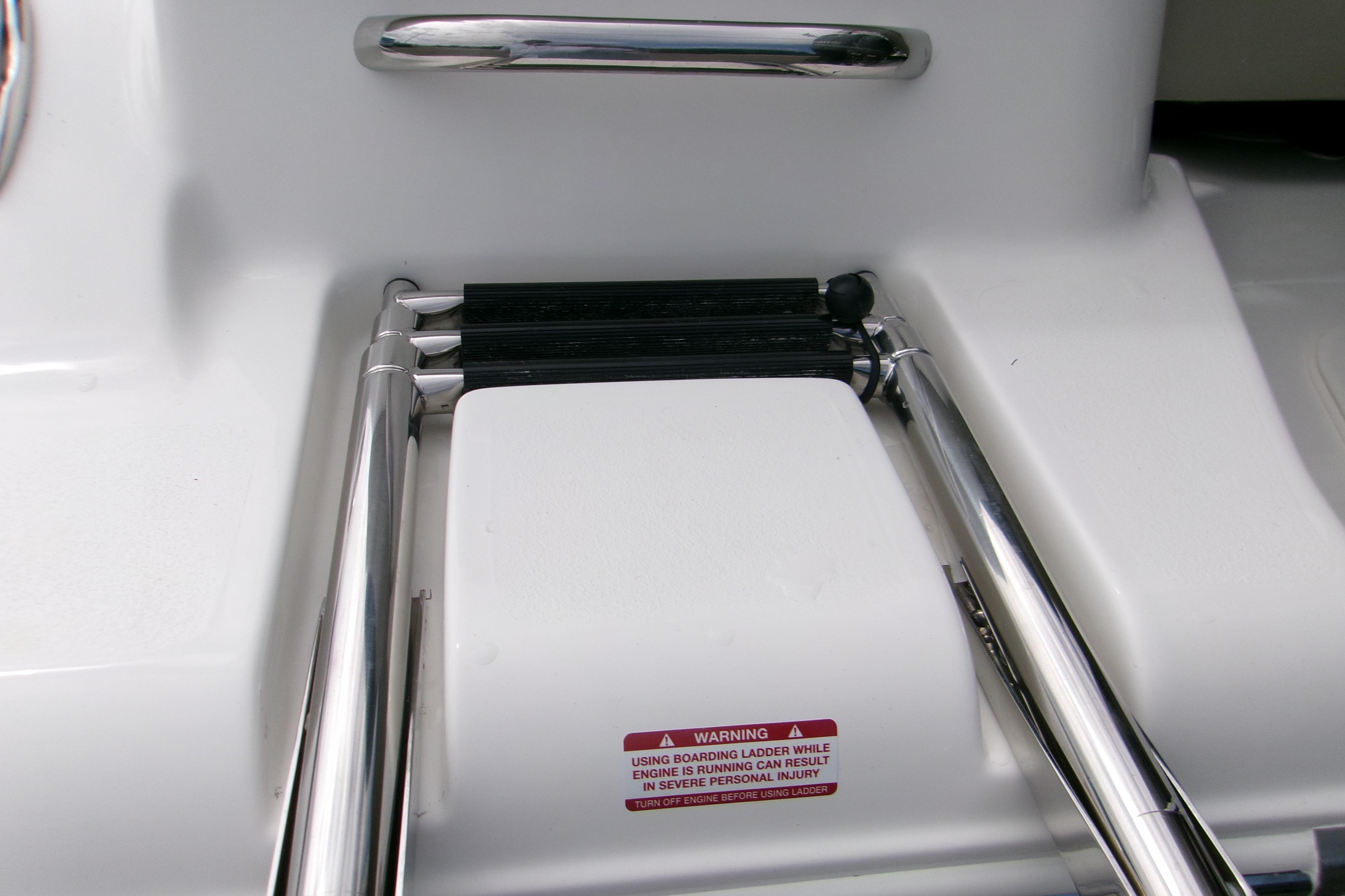 Stainless steel boarding ladder on 2026 Key West 189 FS boat.