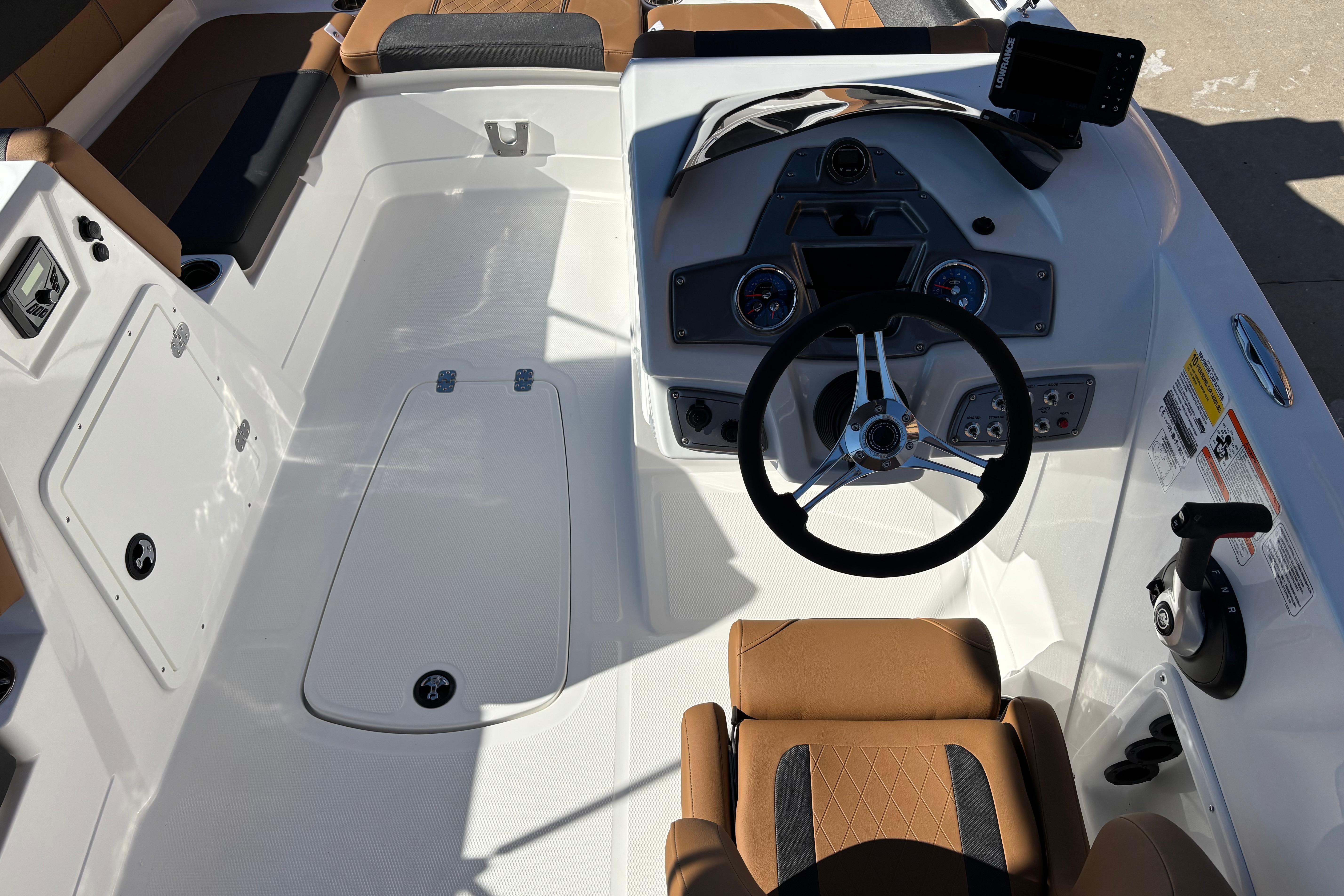 2026 Tahoe 1950 boat interior with steering wheel and control panel.