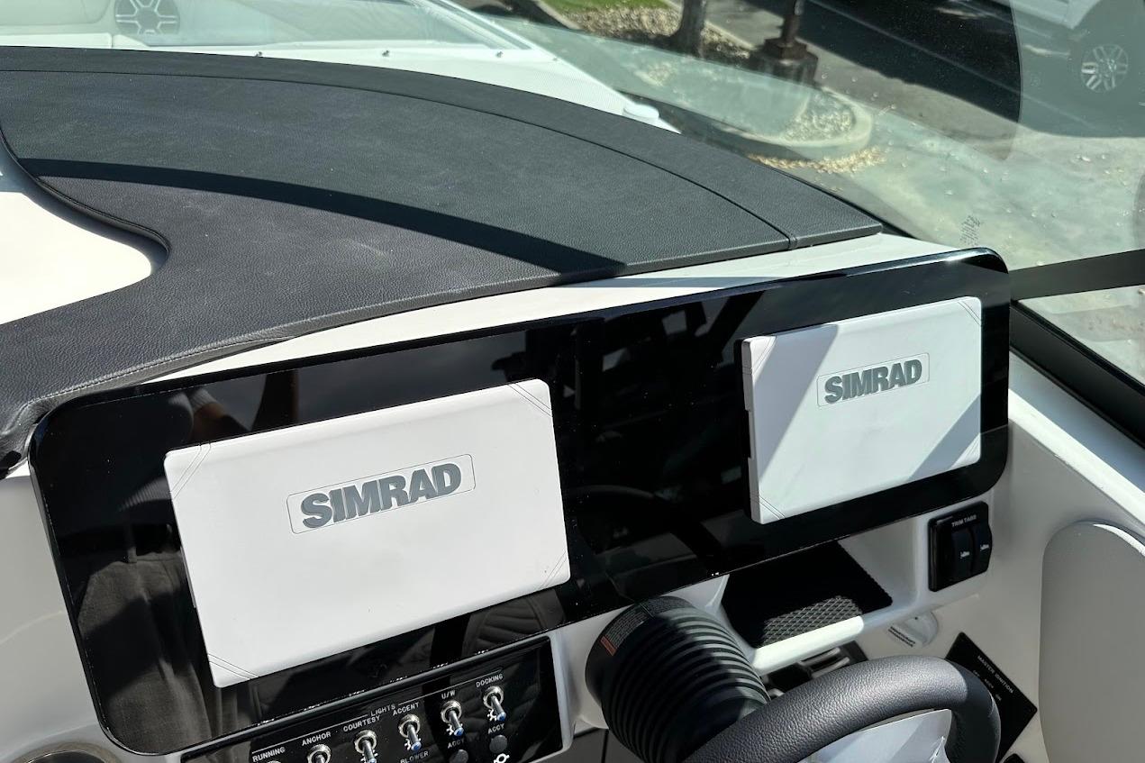 Dashboard of 2026 Sea Ray SDX 230 Surf with dual Simrad displays.