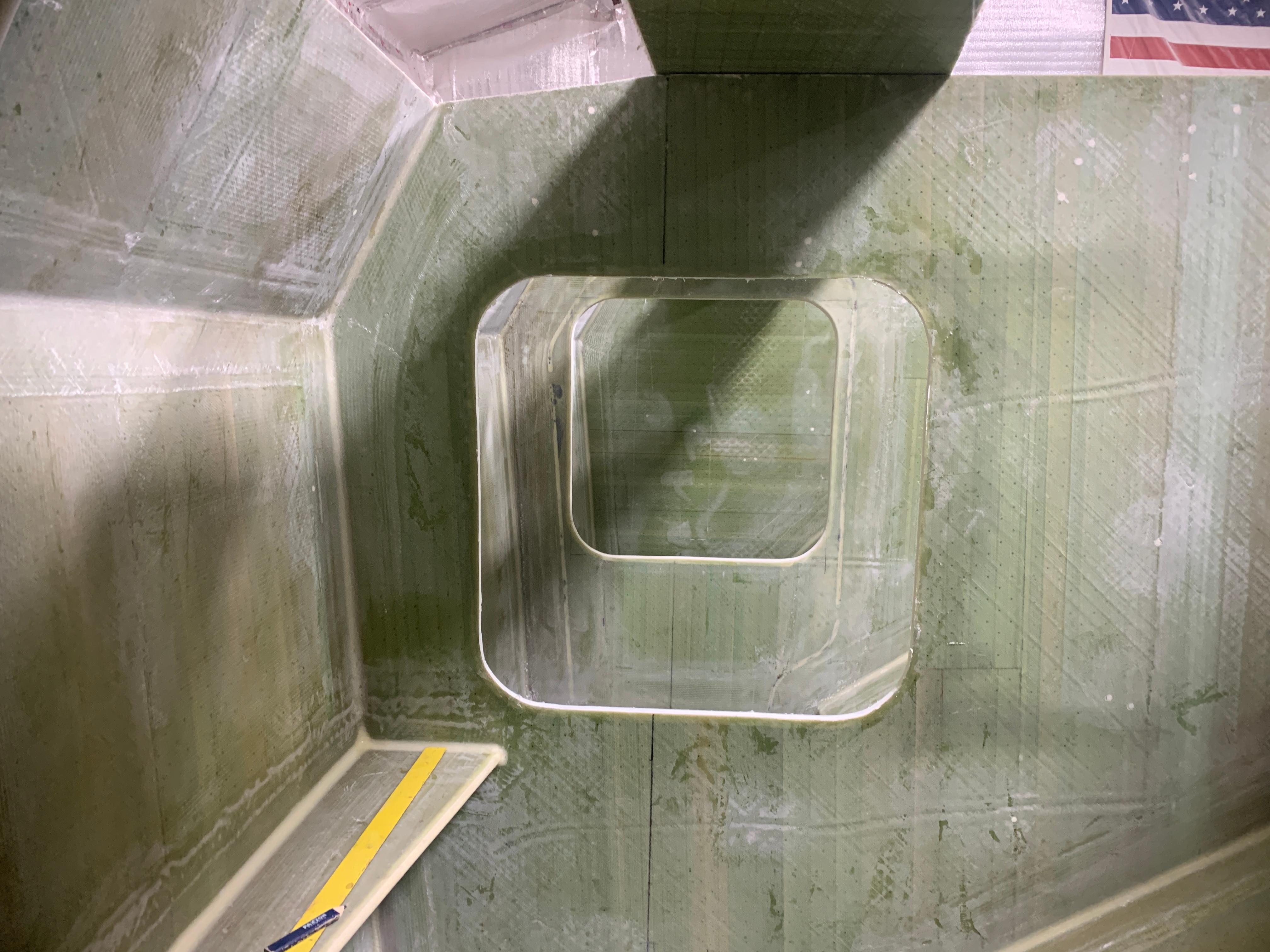 Interior view of 2024 Schionning Arrow 1280 S catamaran under construction.
