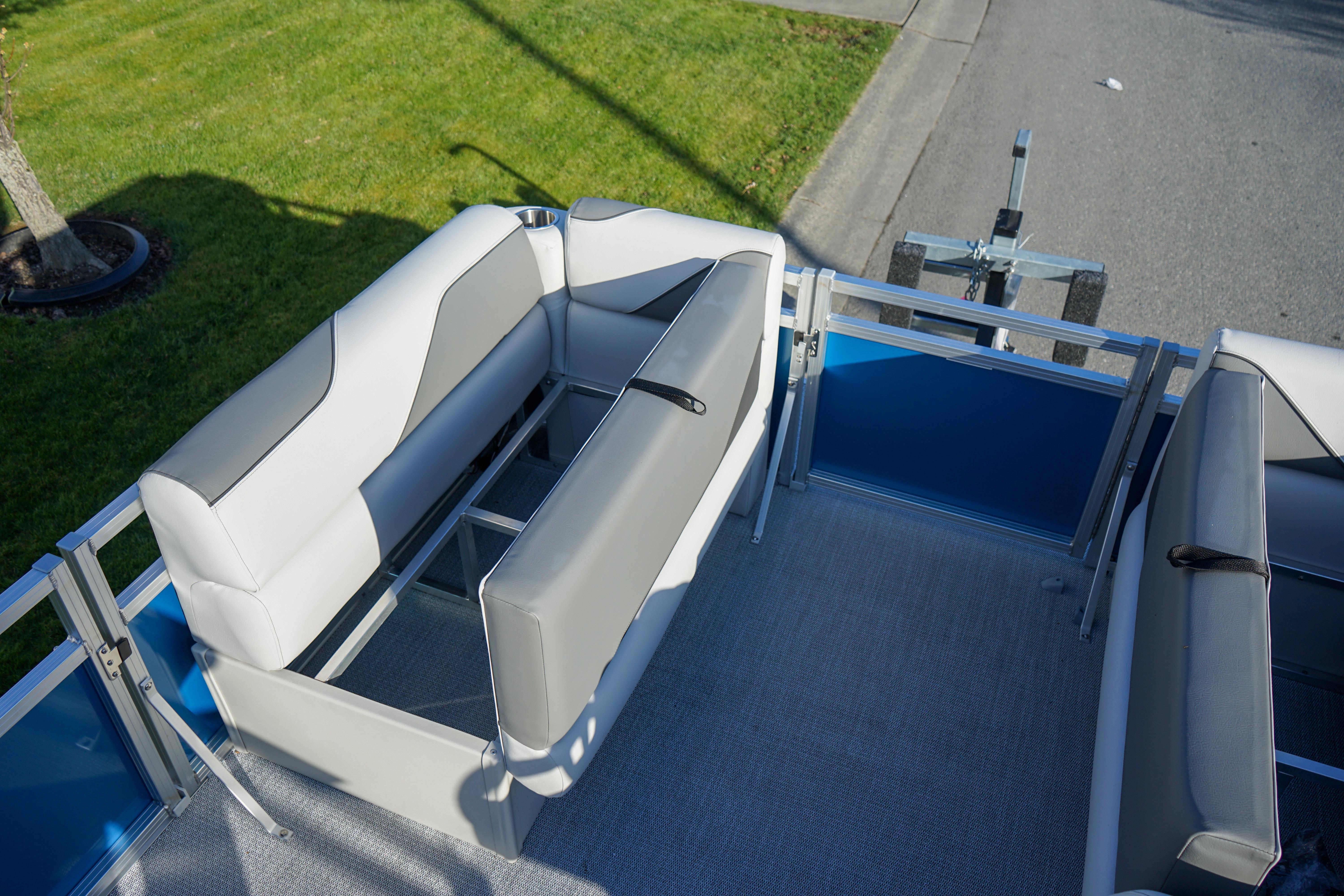 2024 Avalon 17 Venture Cruise pontoon boat interior with gray seating and blue accents.