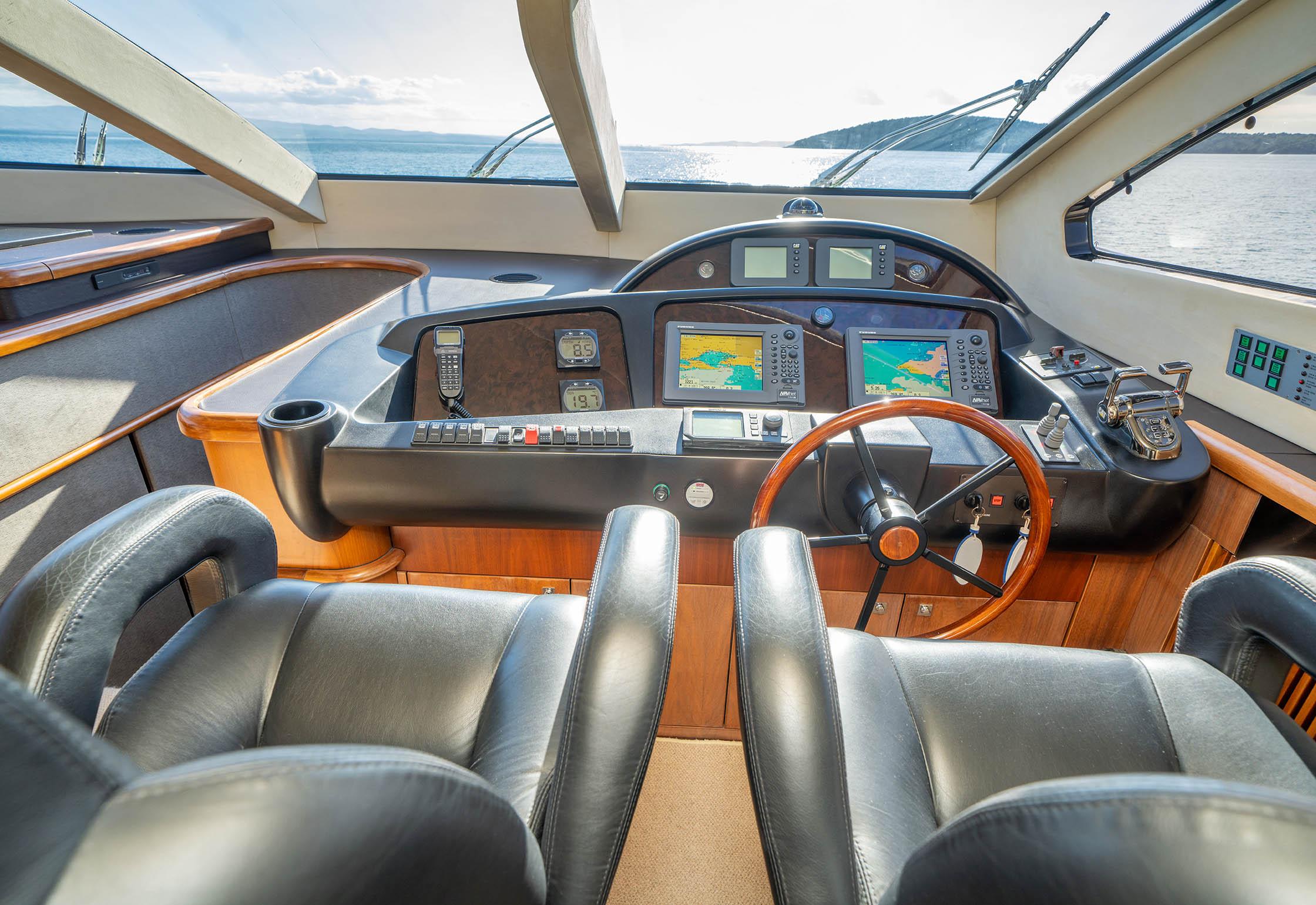 Luxurious 2006 Sunseeker 82 Yacht cockpit with leather seats and advanced navigation systems.