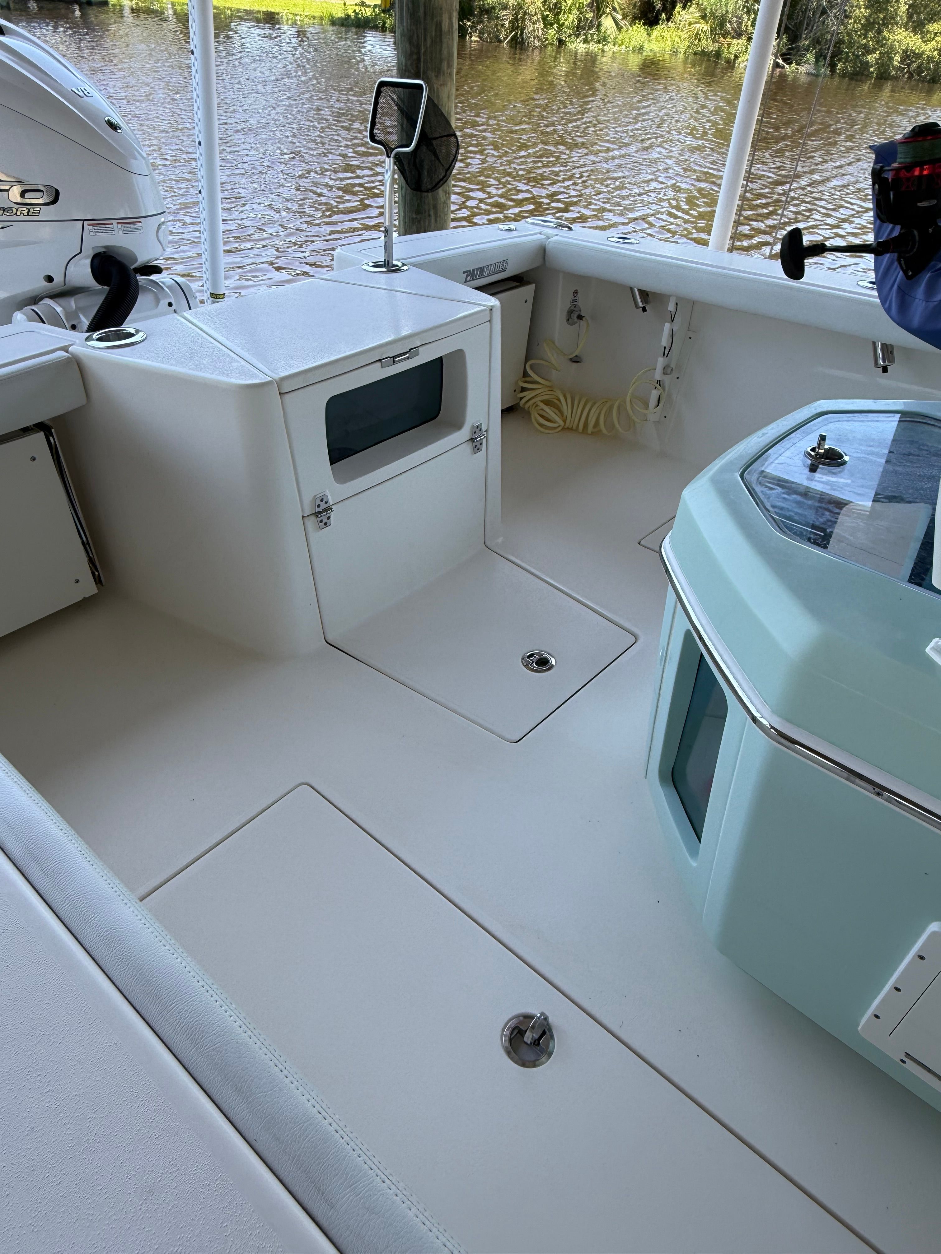 Interior of a 2024 Pathfinder 2700 Open boat by the water.